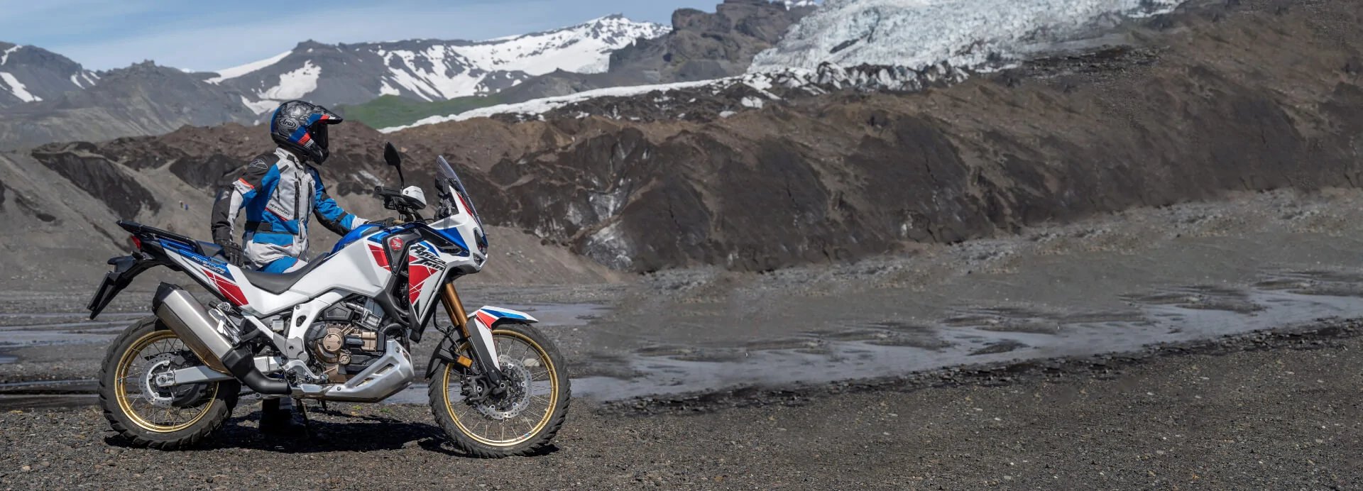 an abstract photo of a curved building with a blue sky in the background
