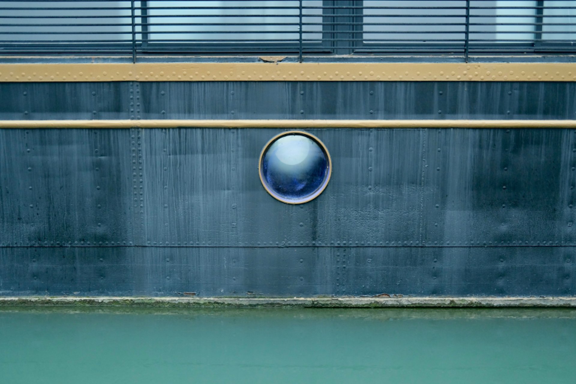 Porthole on the hull of a Dutch barge