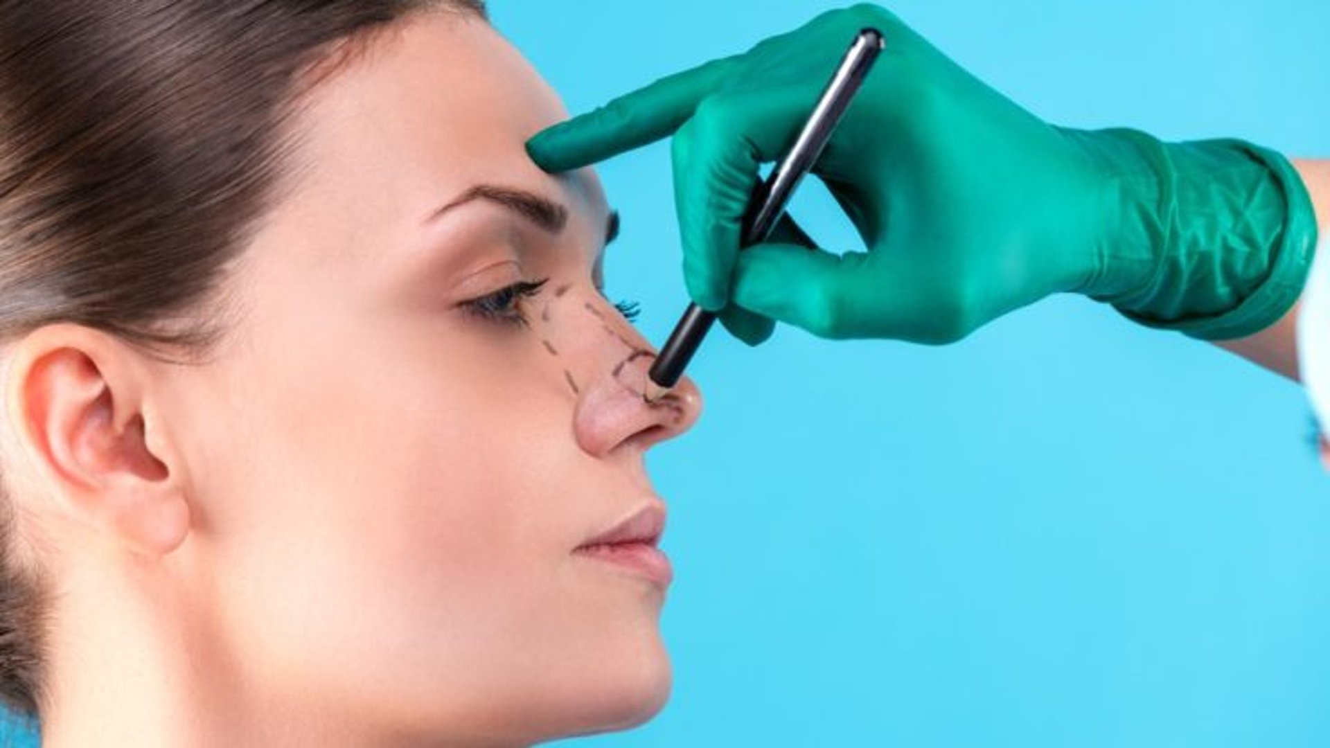 woman holding pen and white cotton candy