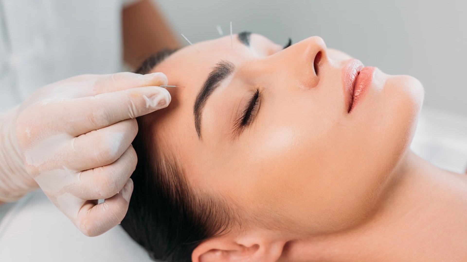 person holding woman nose