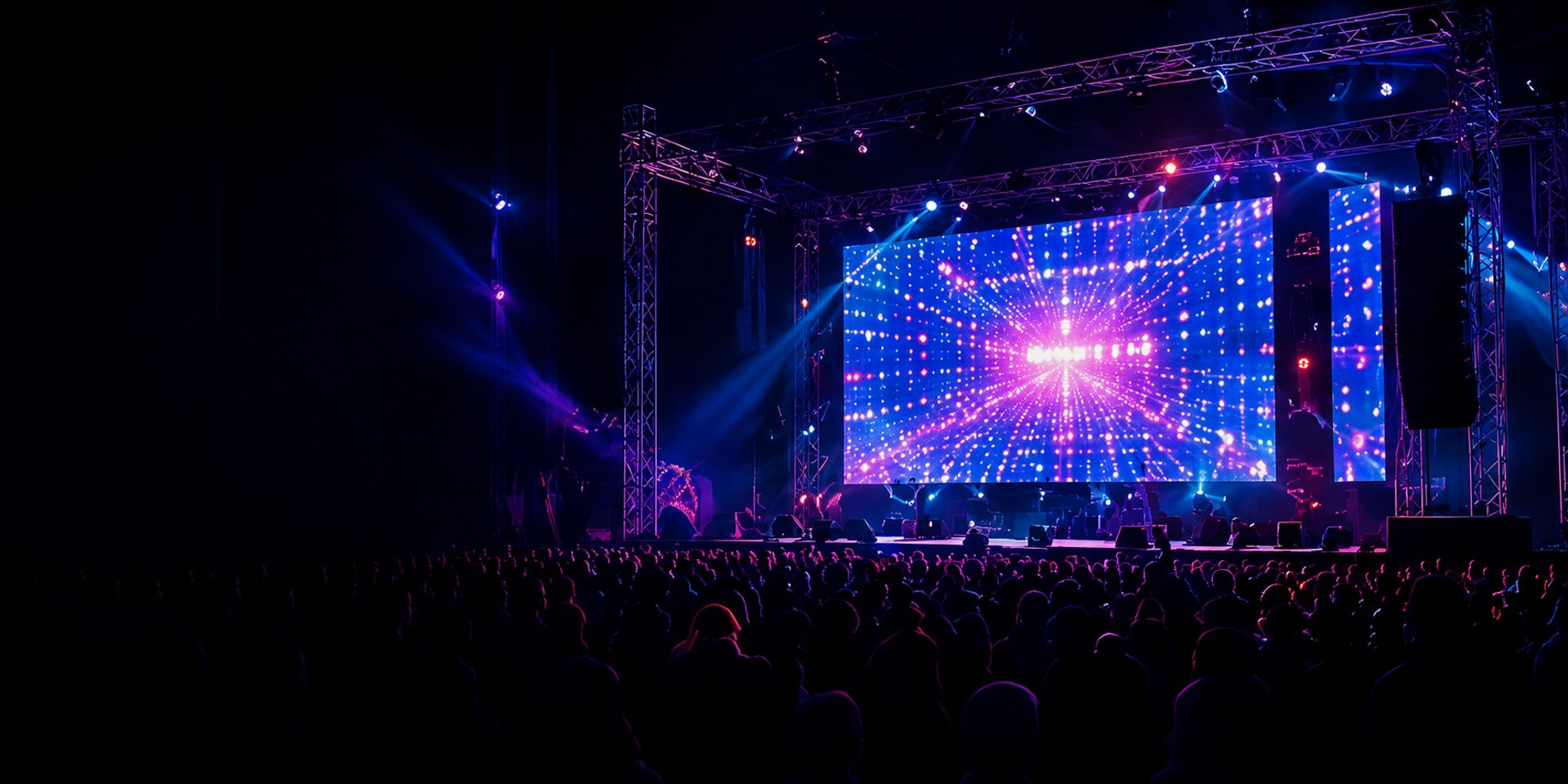 A stage performance with audience in dark theater