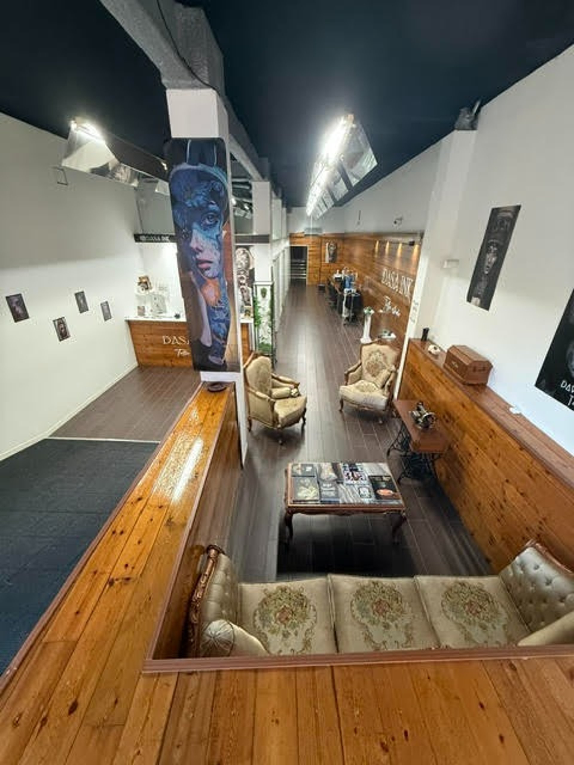 an abstract photo of a curved building with a blue sky in the background