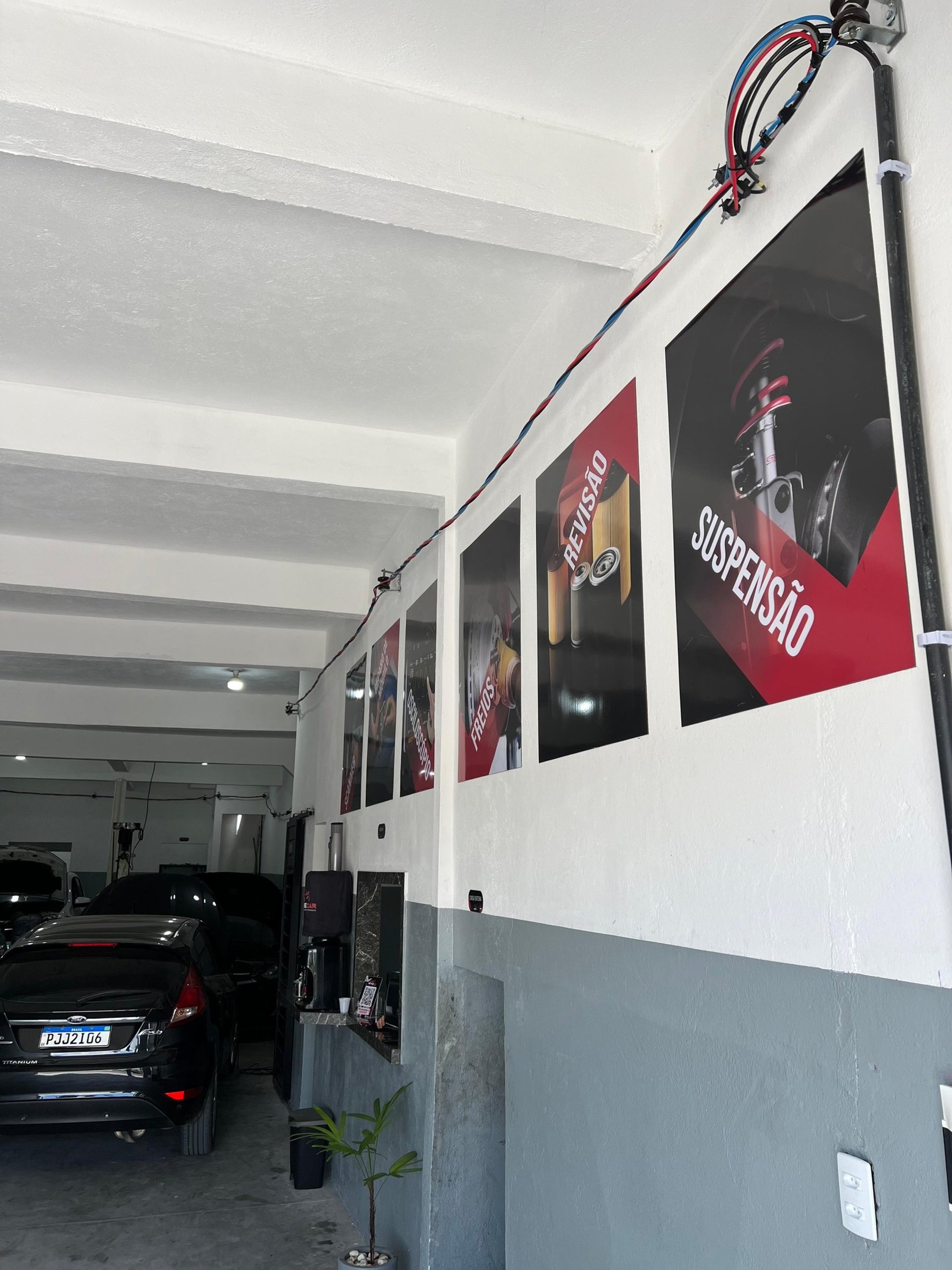 red ferrari 458 italia parked in front of white wall