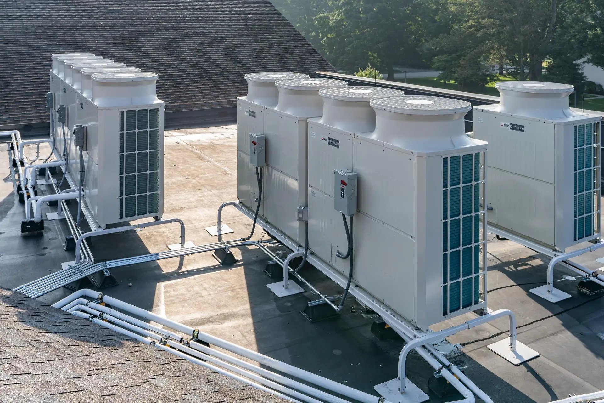 pile of white outdoor AC units