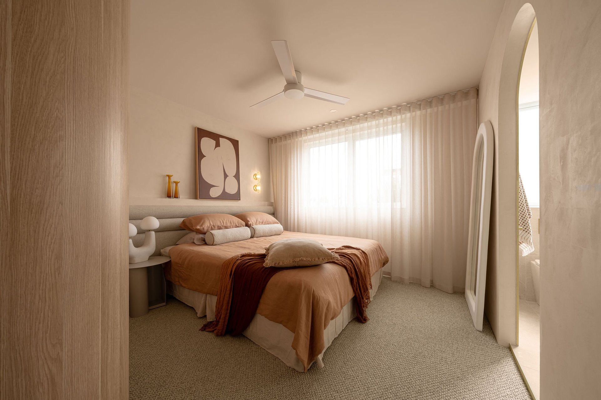 an abstract photo of a curved building with a blue sky in the background