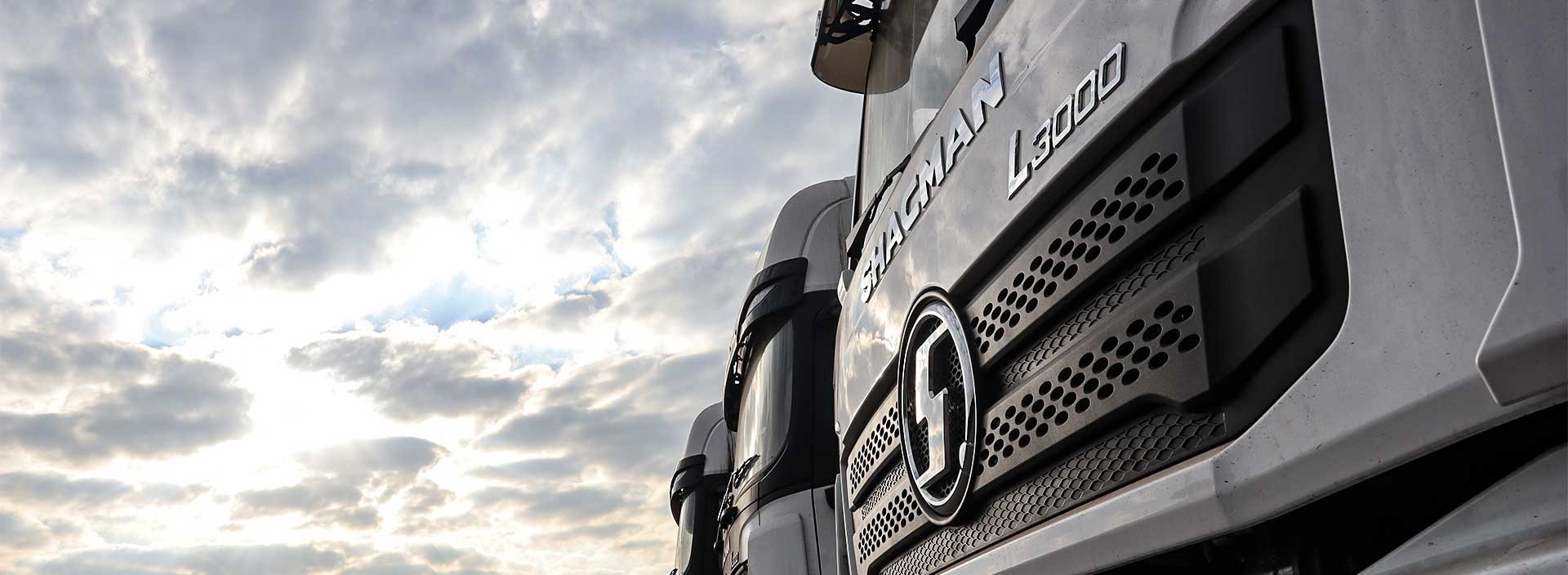 an abstract photo of a curved building with a blue sky in the background