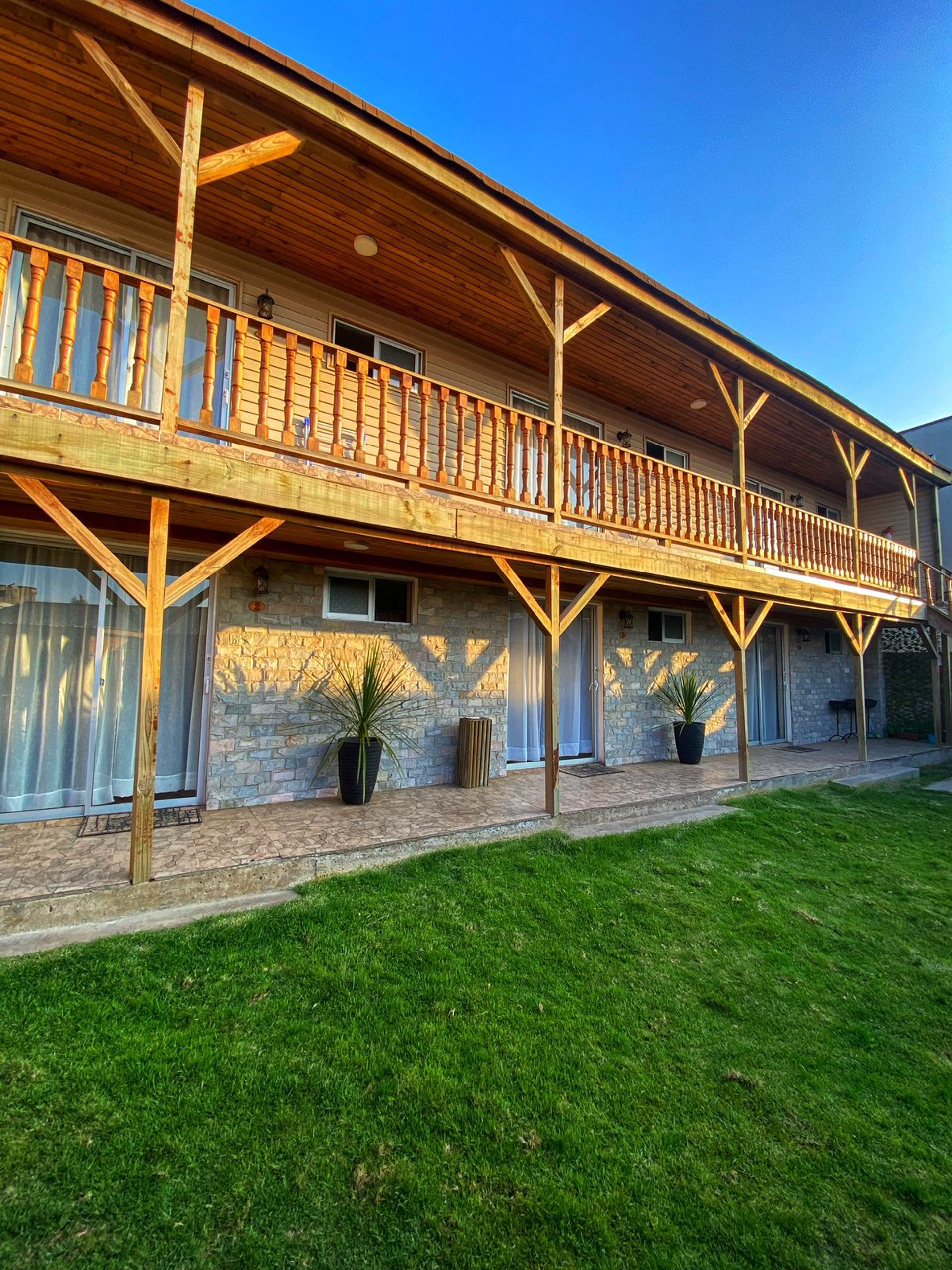 woman wearing yellow long-sleeved dress under white clouds and blue sky during daytime