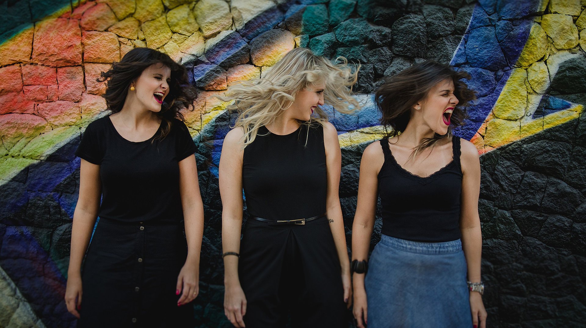 an abstract photo of a curved building with a blue sky in the background