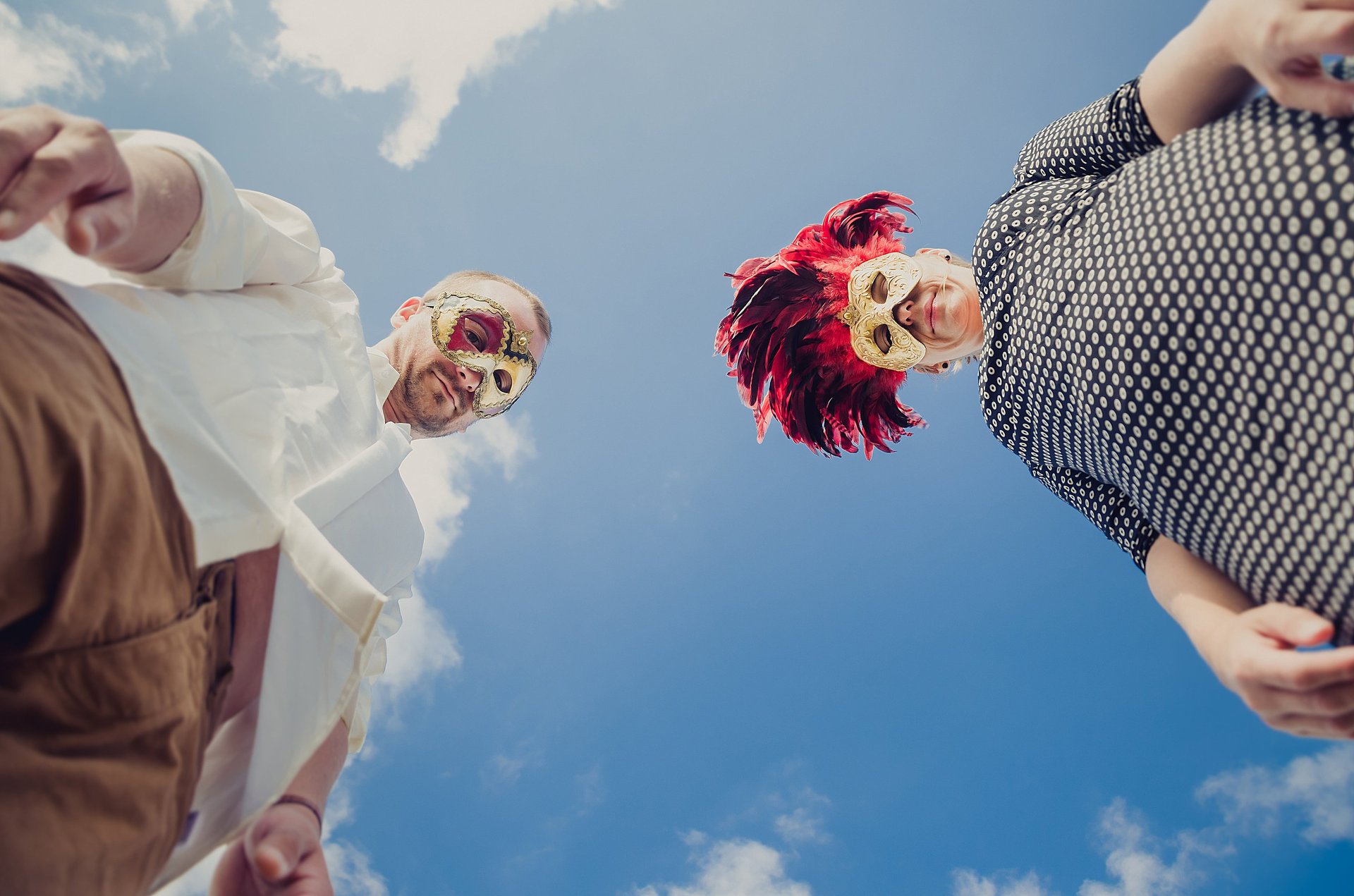 an abstract photo of a curved building with a blue sky in the background