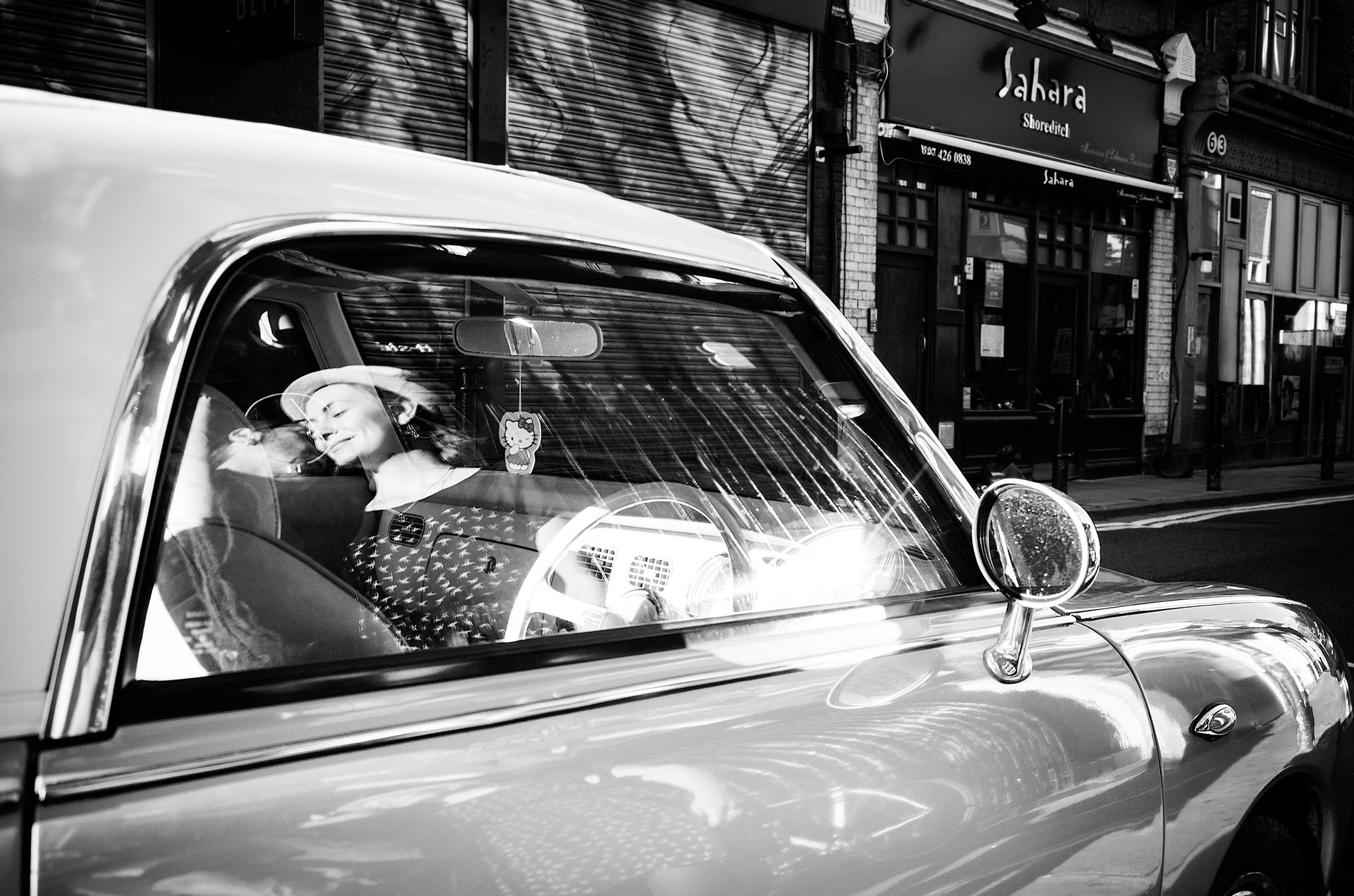 an abstract photo of a curved building with a blue sky in the background