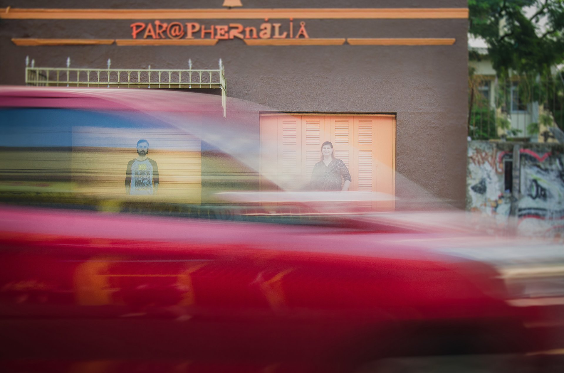 an abstract photo of a curved building with a blue sky in the background