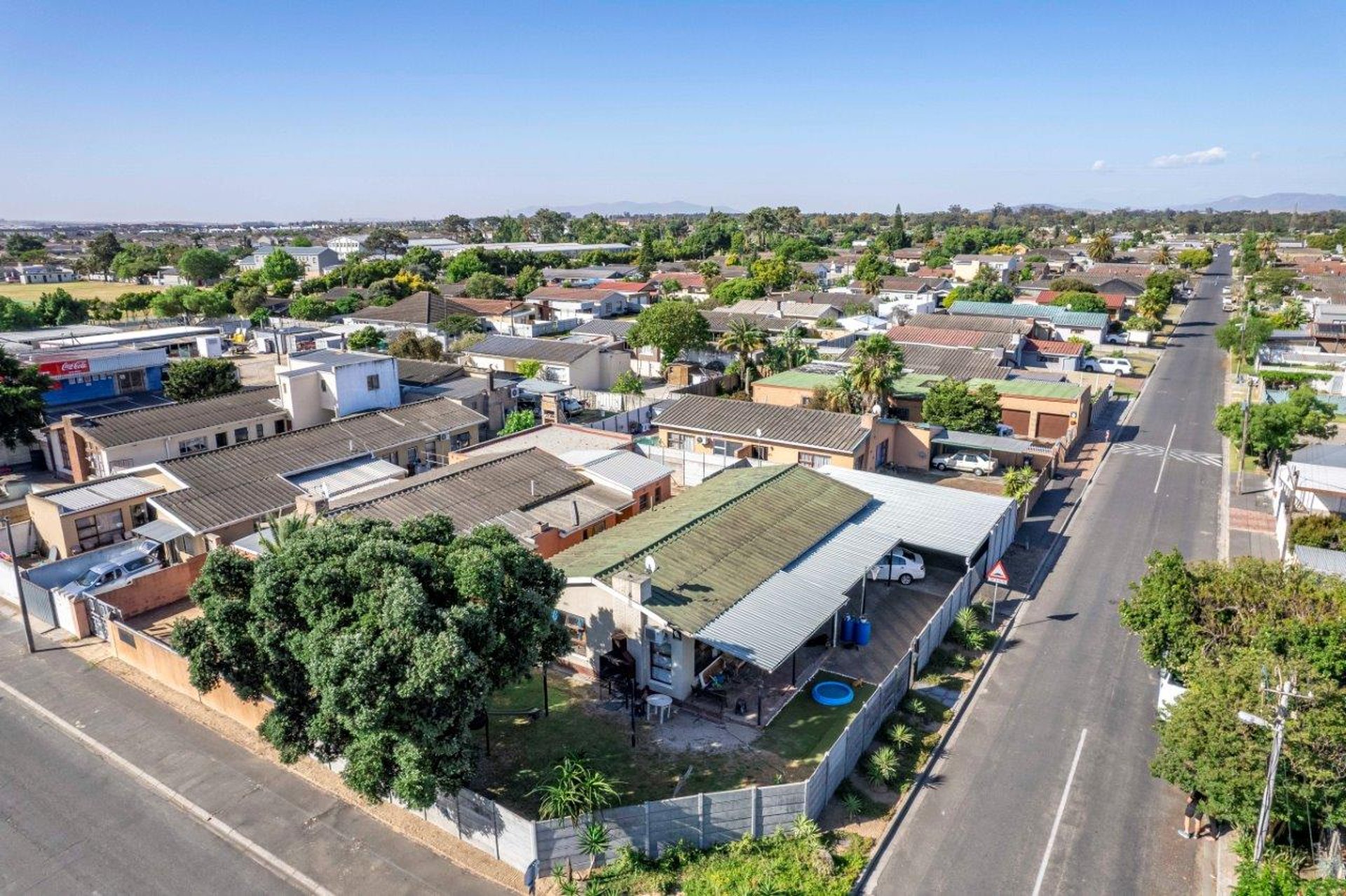 a row of multi - colored houses on a street