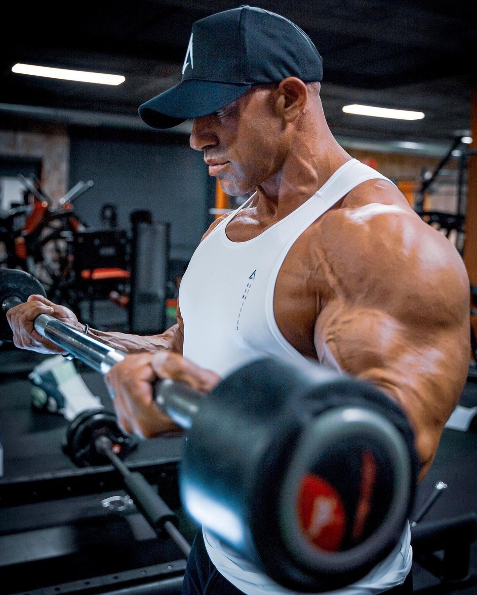 an abstract photo of a curved building with a blue sky in the background