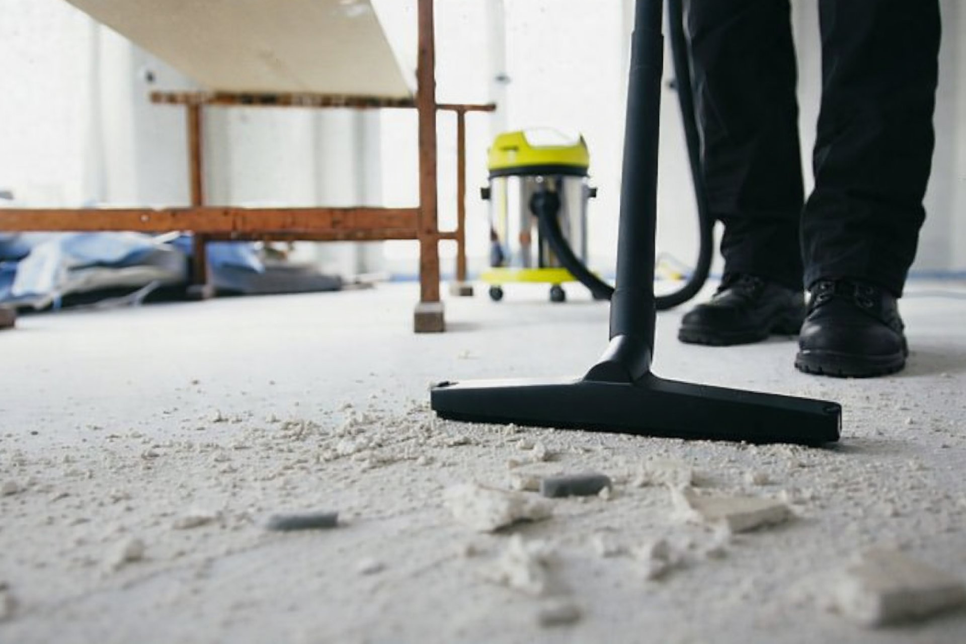 man in yellow shirt and blue denim jeans jumping on brown wooden railings under blue and