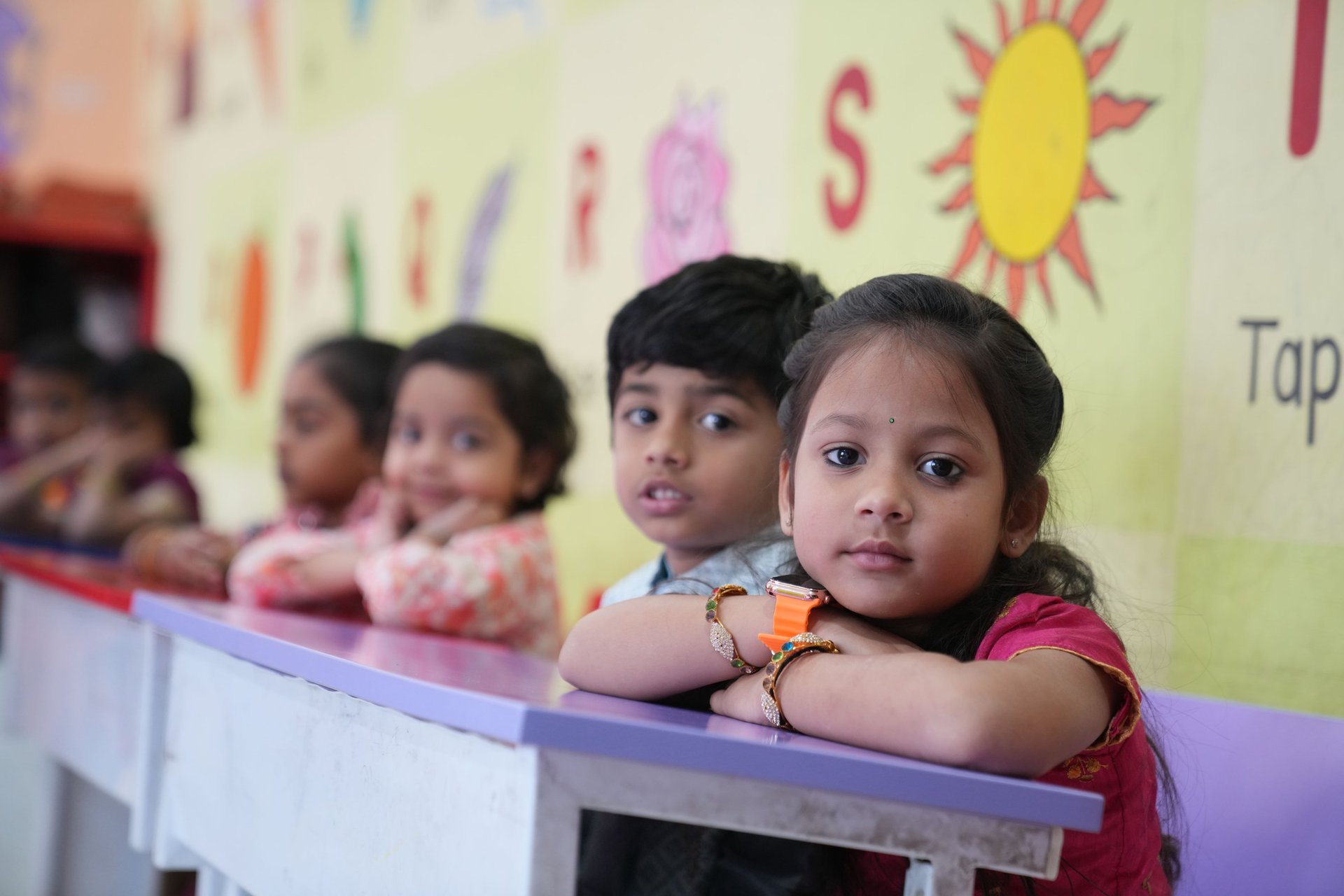 a classroom filled with desks and a chalkboard