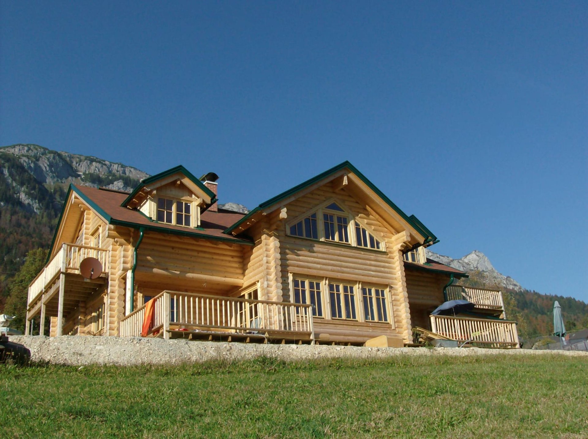 woman wearing yellow long-sleeved dress under white clouds and blue sky during daytime