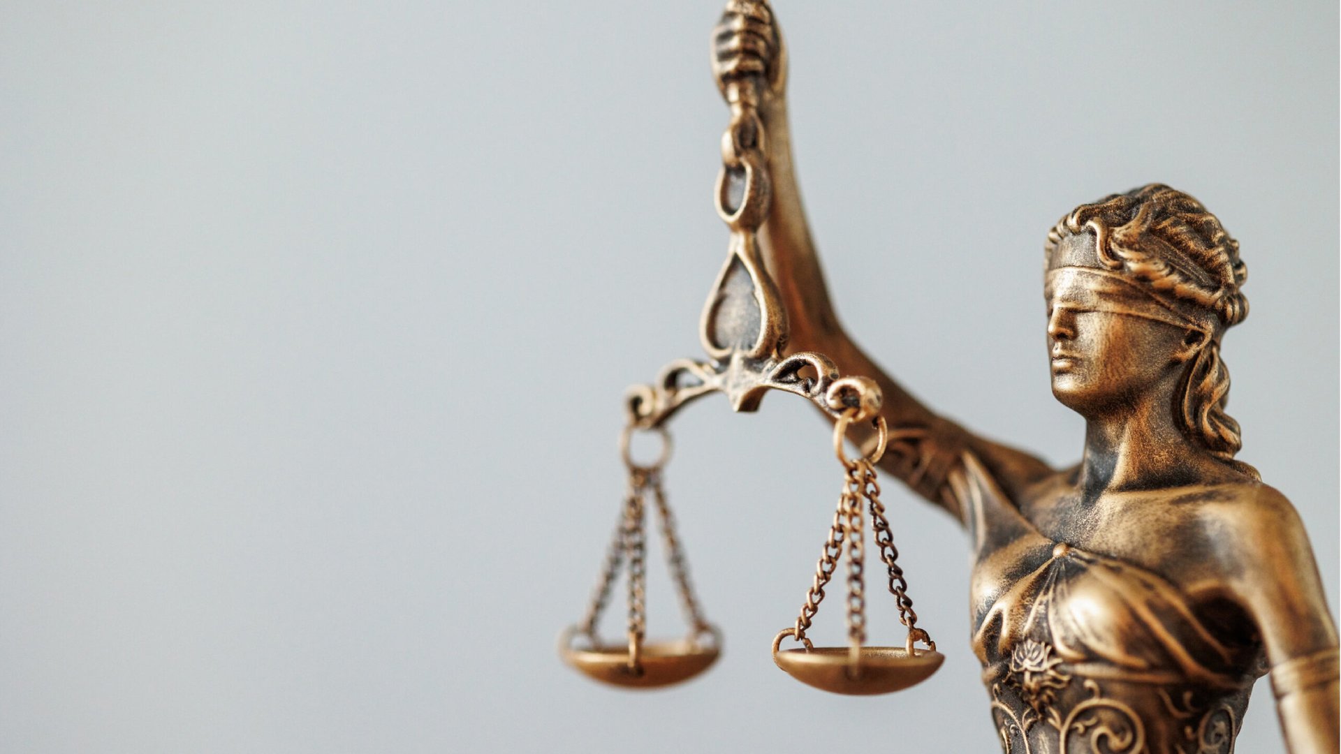 an abstract photo of a curved building with a blue sky in the background