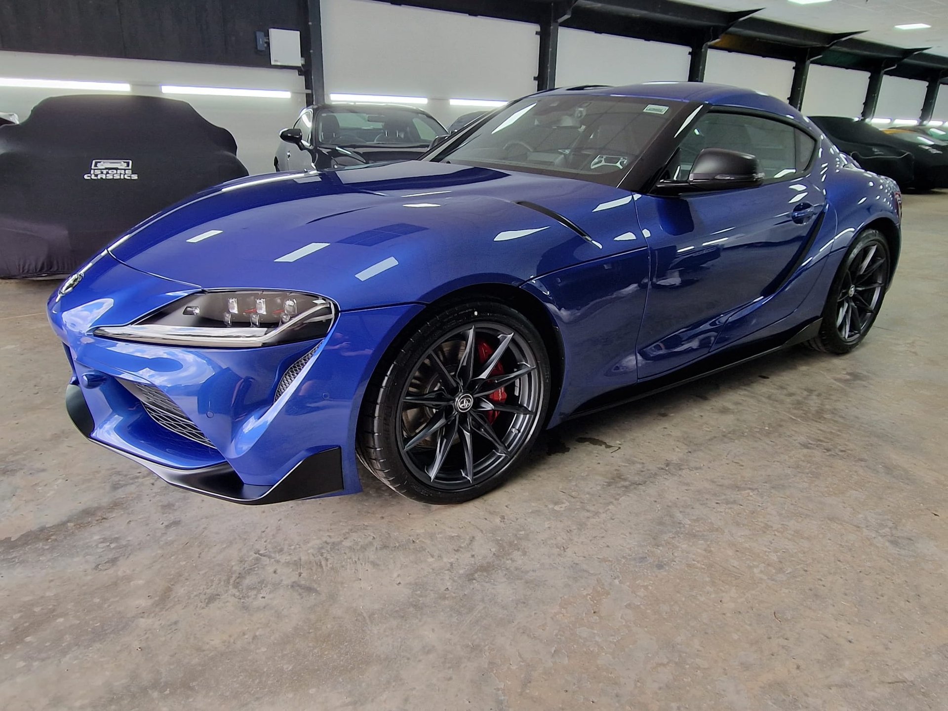 black and brown leather padded tub sofa