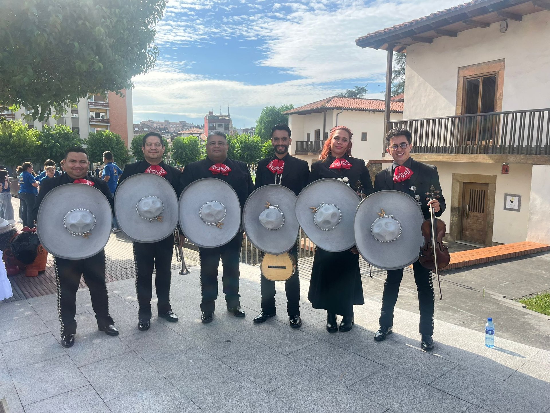 an abstract photo of a curved building with a blue sky in the background