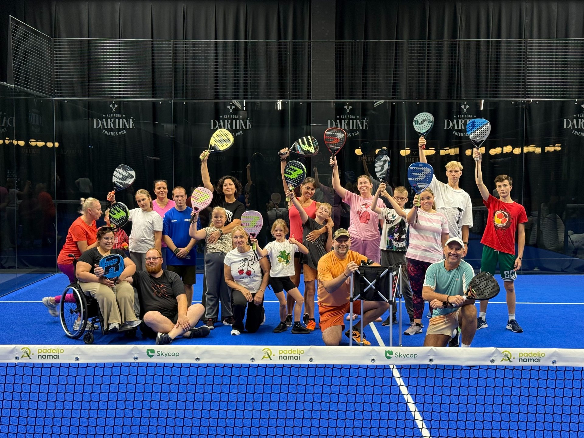 a couple of people holding surfboards on a beach