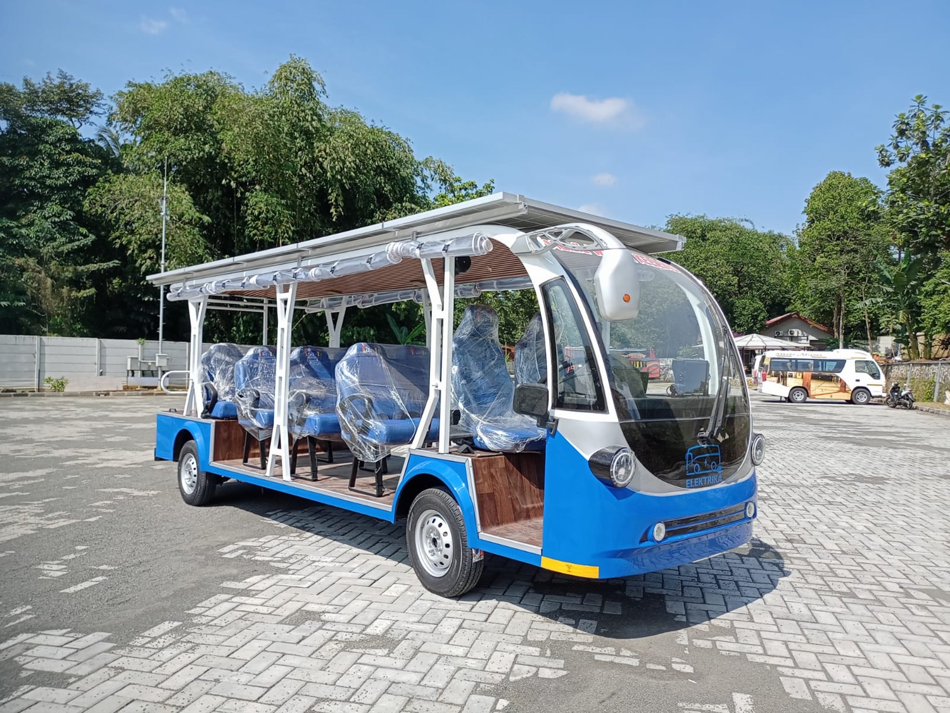 woman wearing yellow long-sleeved dress under white clouds and blue sky during daytime
