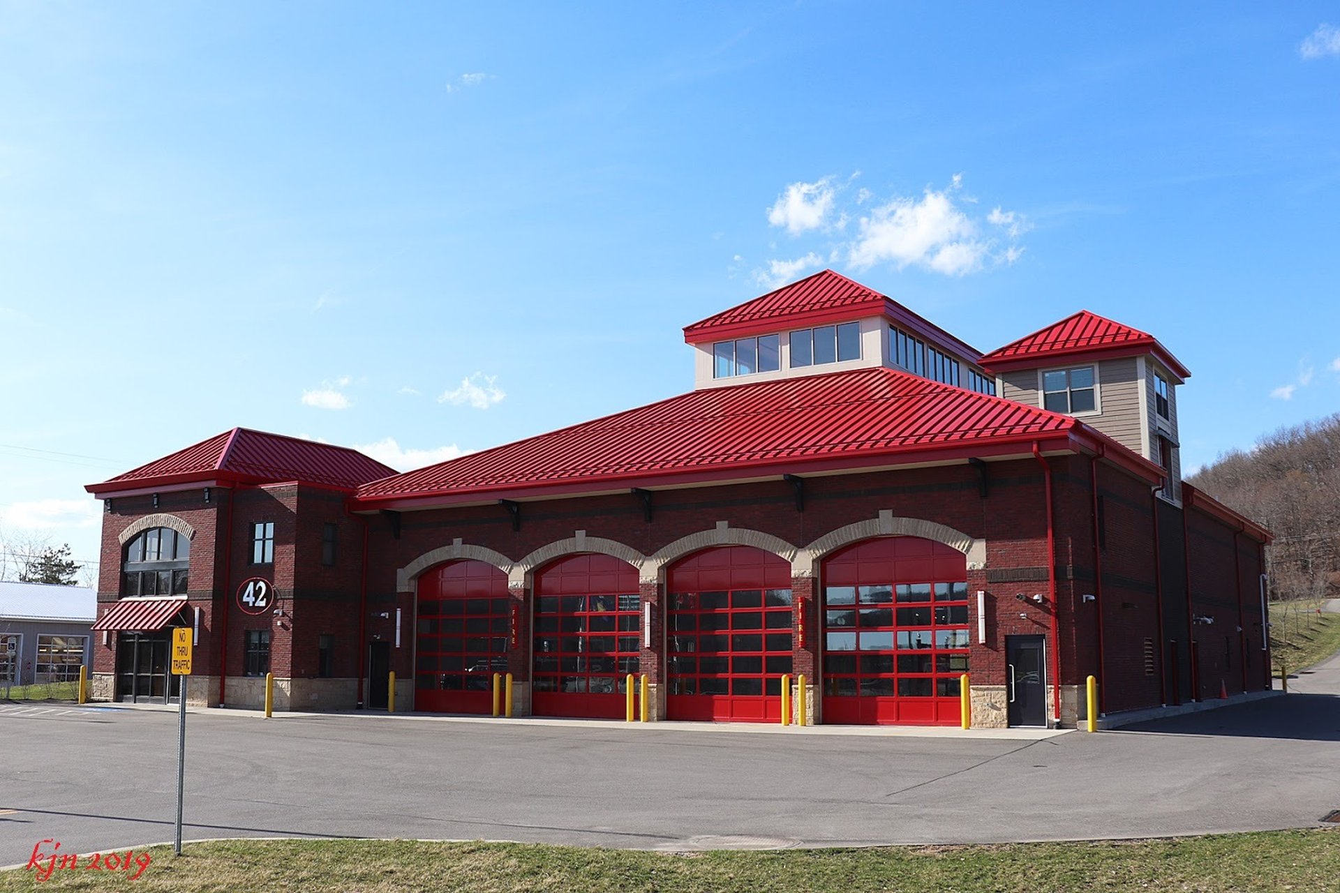 black and brown leather padded tub sofa