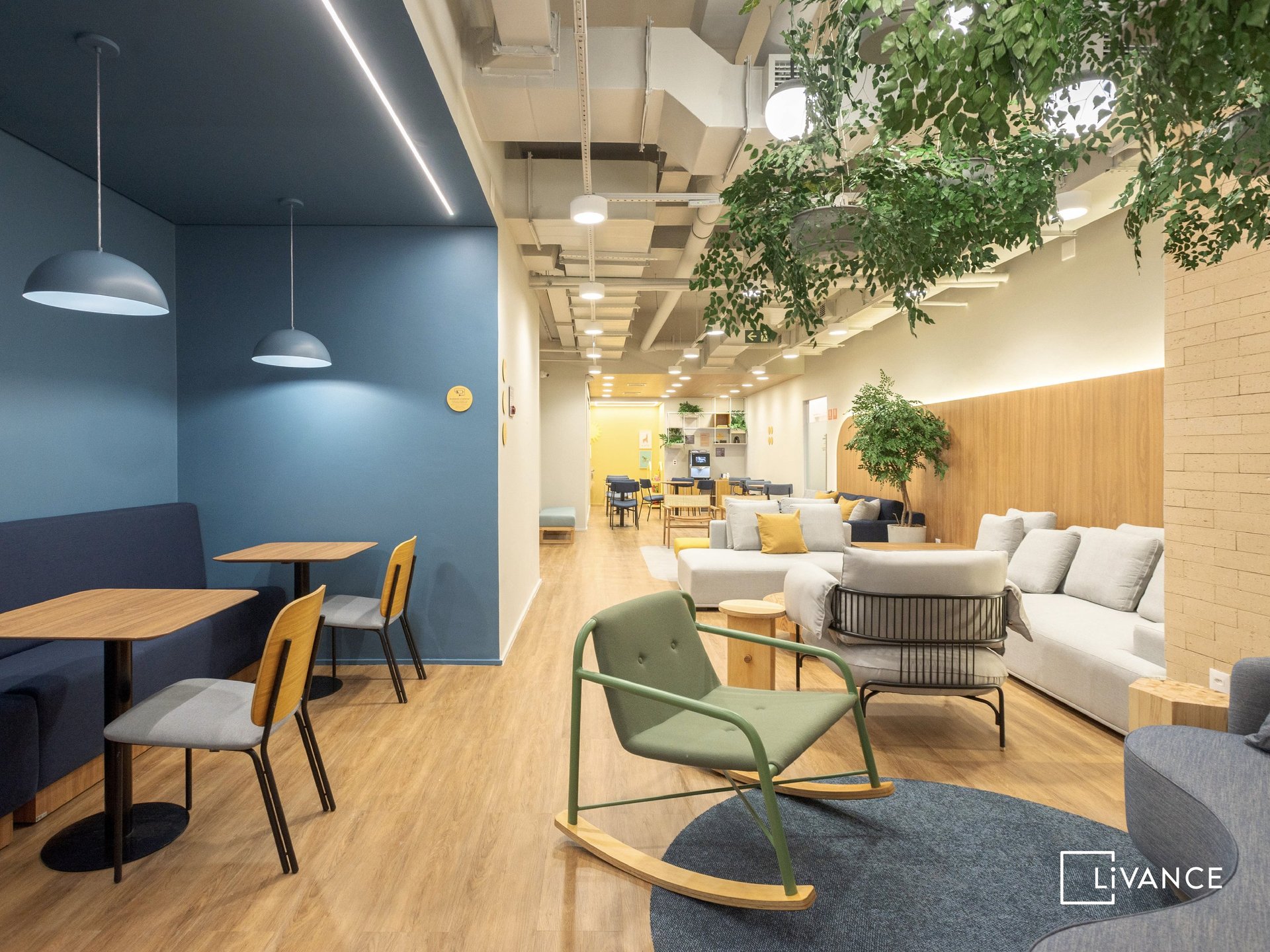 an abstract photo of a curved building with a blue sky in the background