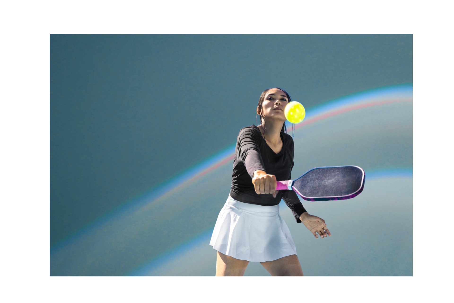 a tennis court next to a body of water