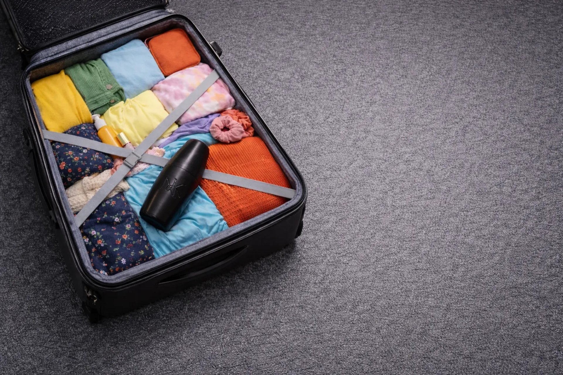 an abstract photo of a curved building with a blue sky in the background