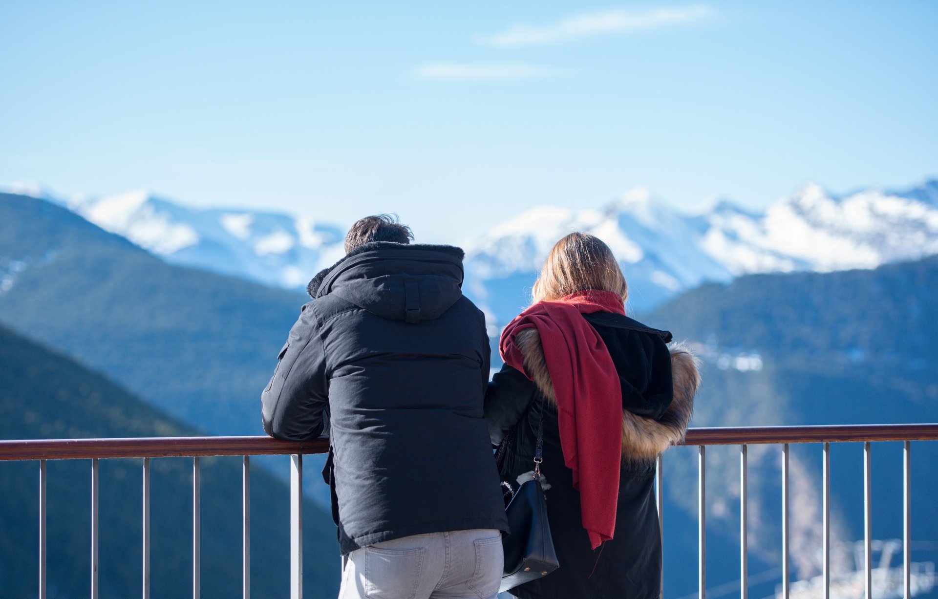 woman wearing yellow long-sleeved dress under white clouds and blue sky during daytime