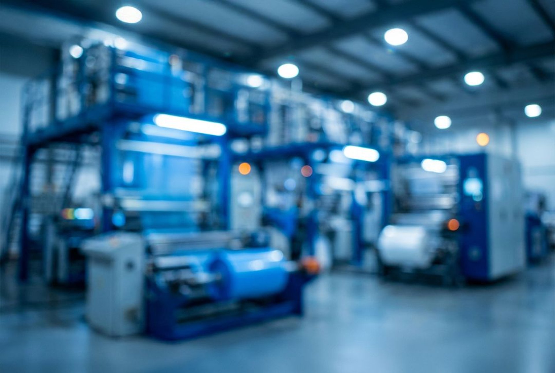 an abstract photo of a curved building with a blue sky in the background
