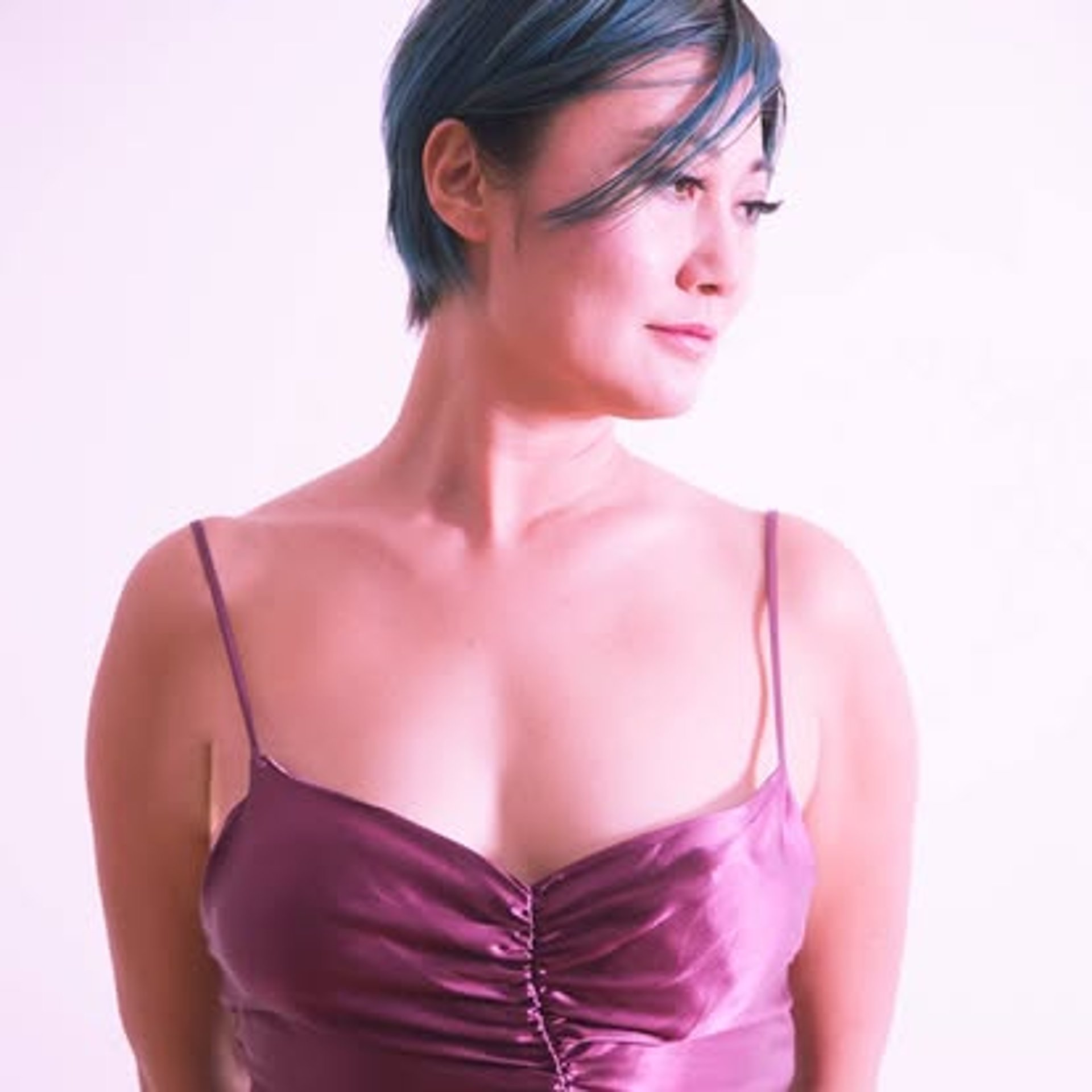 an abstract photo of a curved building with a blue sky in the background