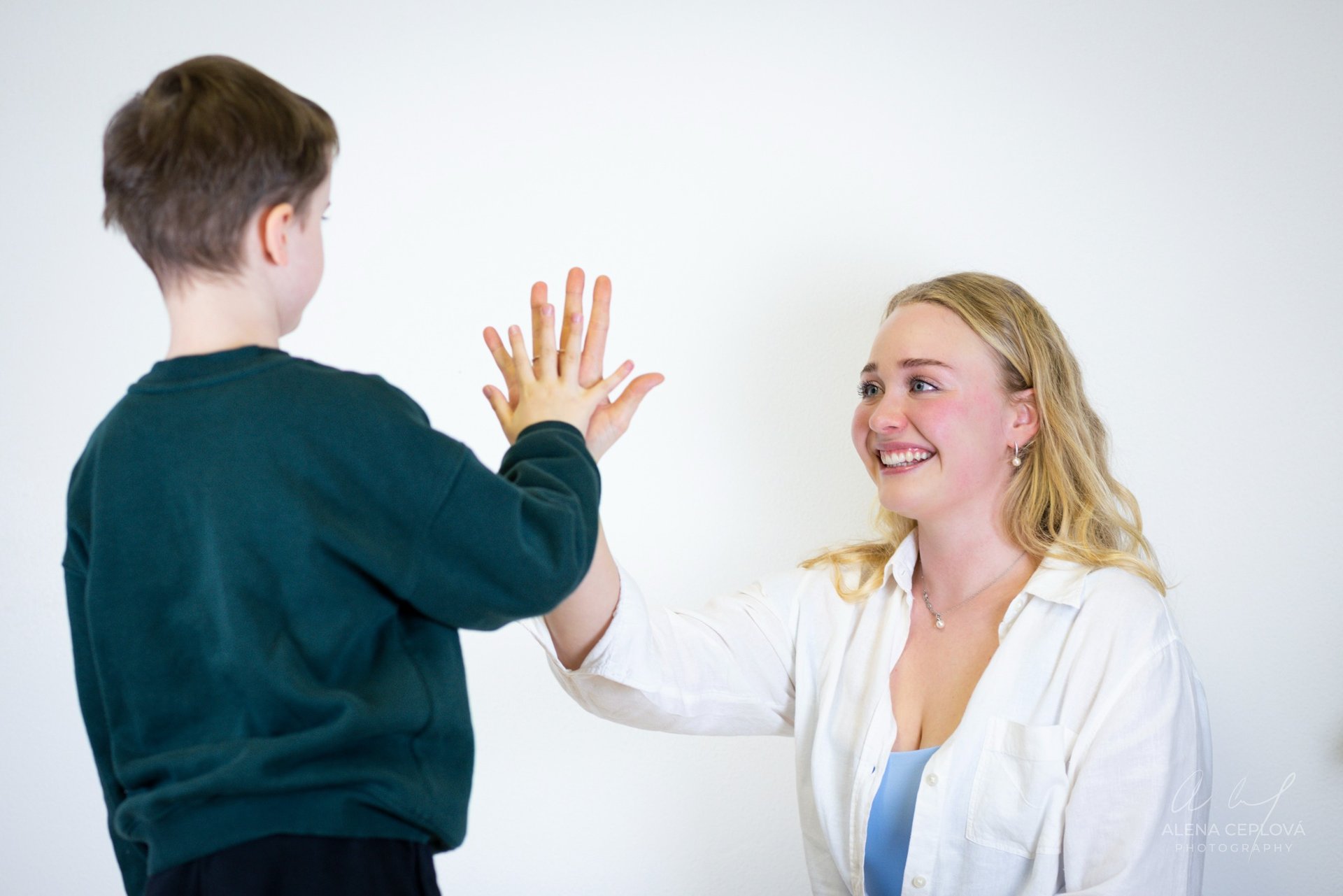 boy holding green mask