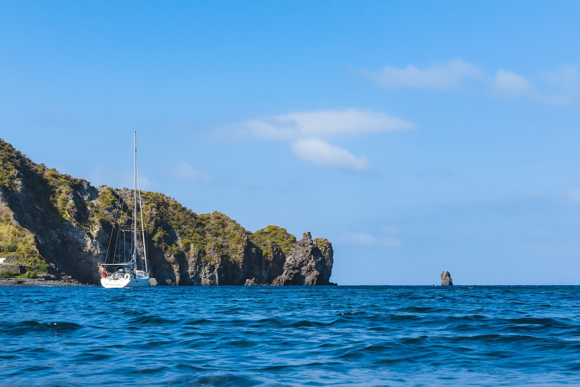 an abstract photo of a curved building with a blue sky in the background
