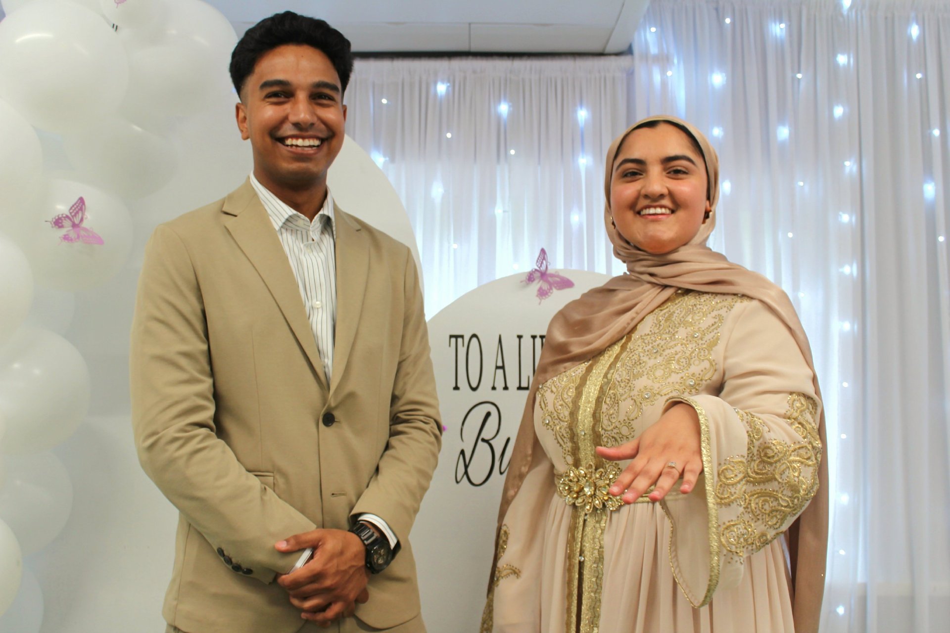couple wearing silver-colored rings