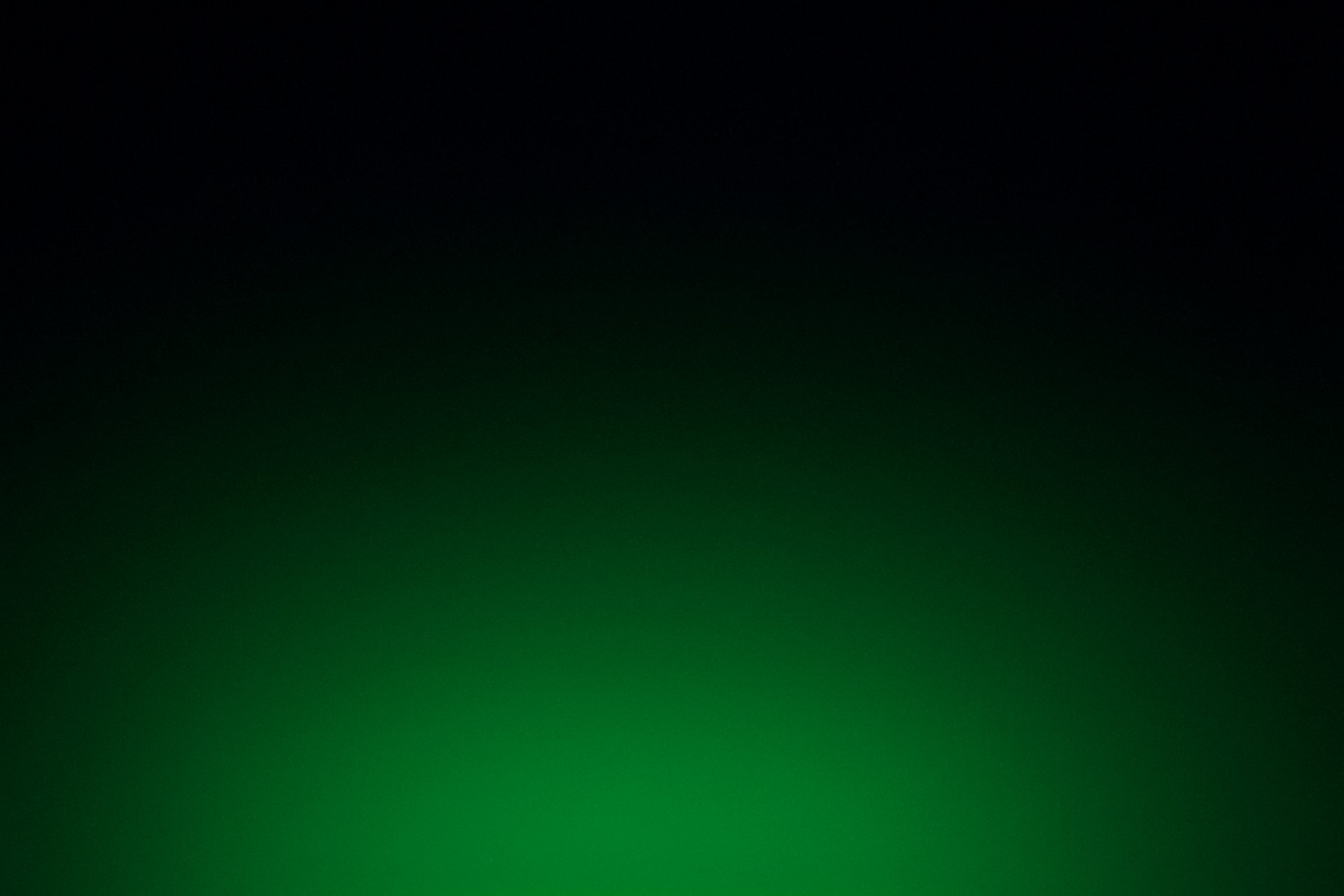 a tall building with a green light on it's side