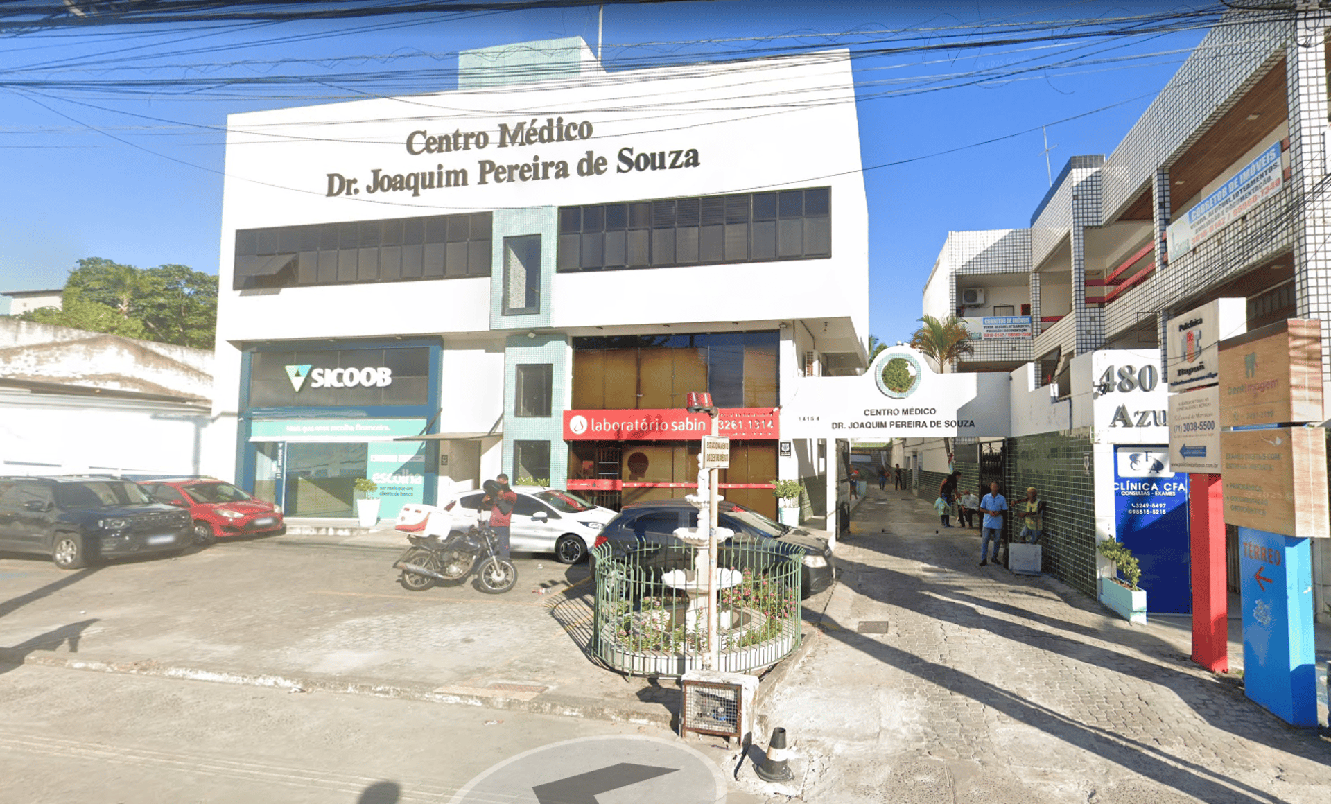 woman wearing yellow long-sleeved dress under white clouds and blue sky during daytime