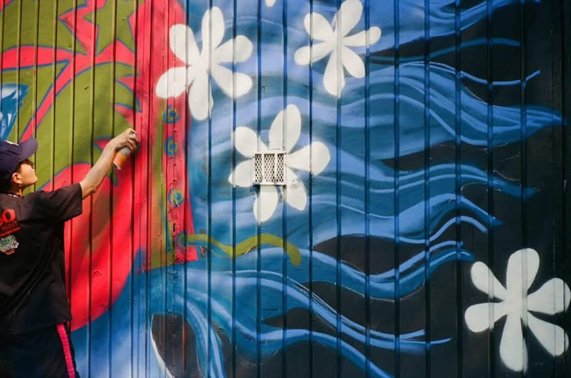 an abstract photo of a curved building with a blue sky in the background