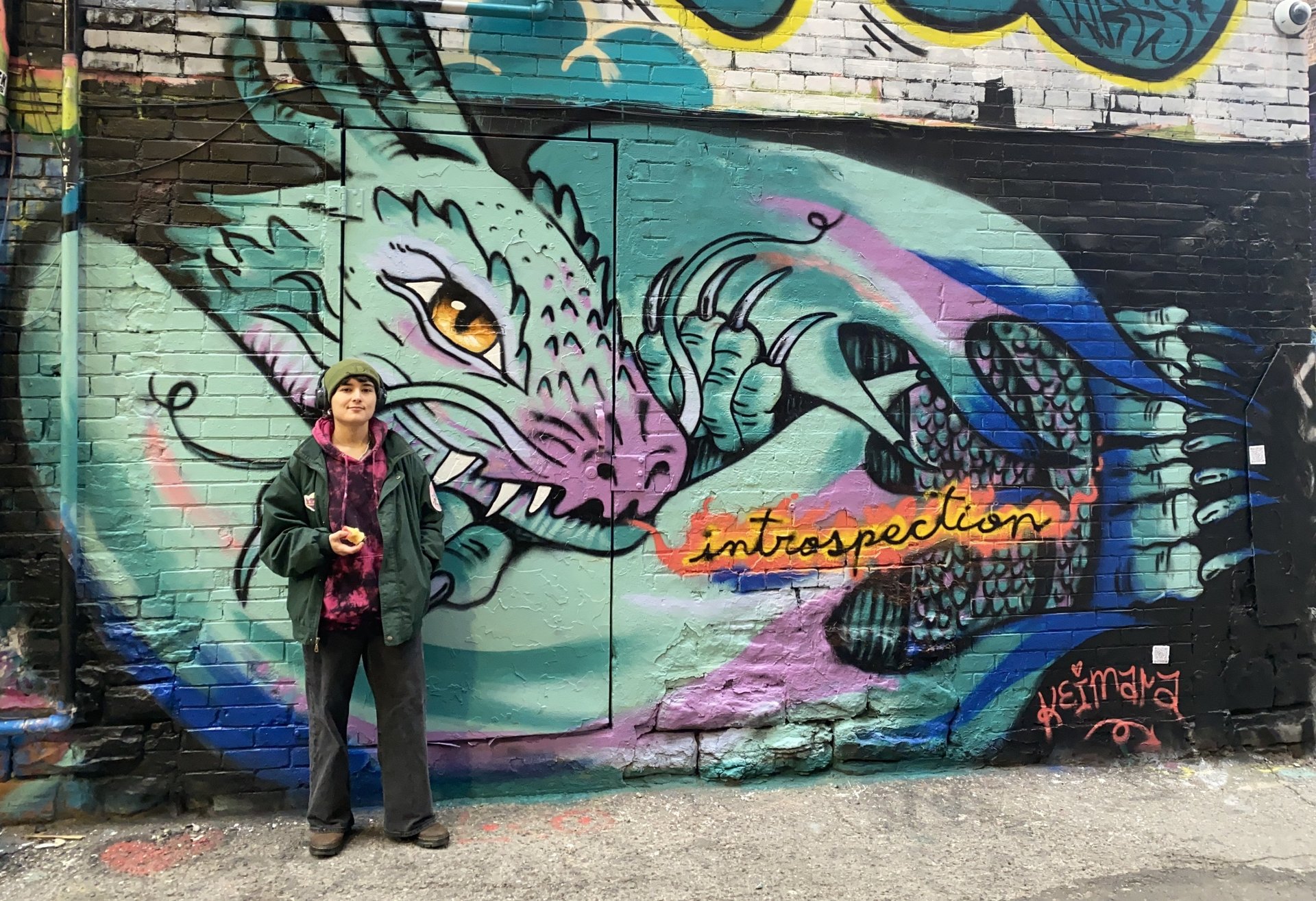an abstract photo of a curved building with a blue sky in the background