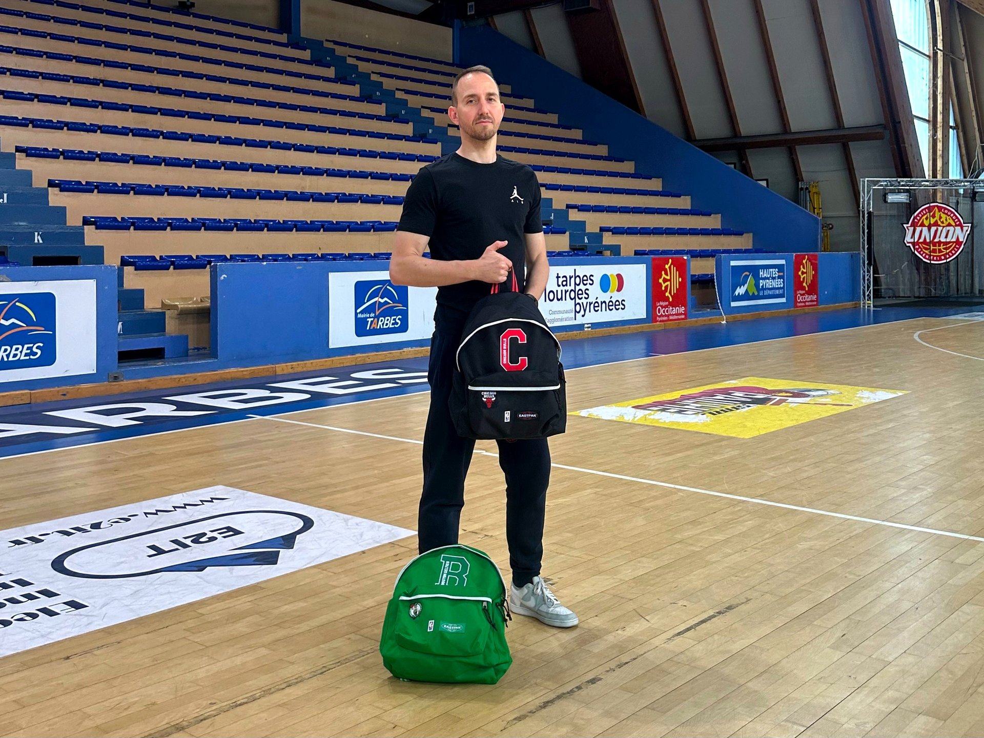 an abstract photo of a curved building with a blue sky in the background
