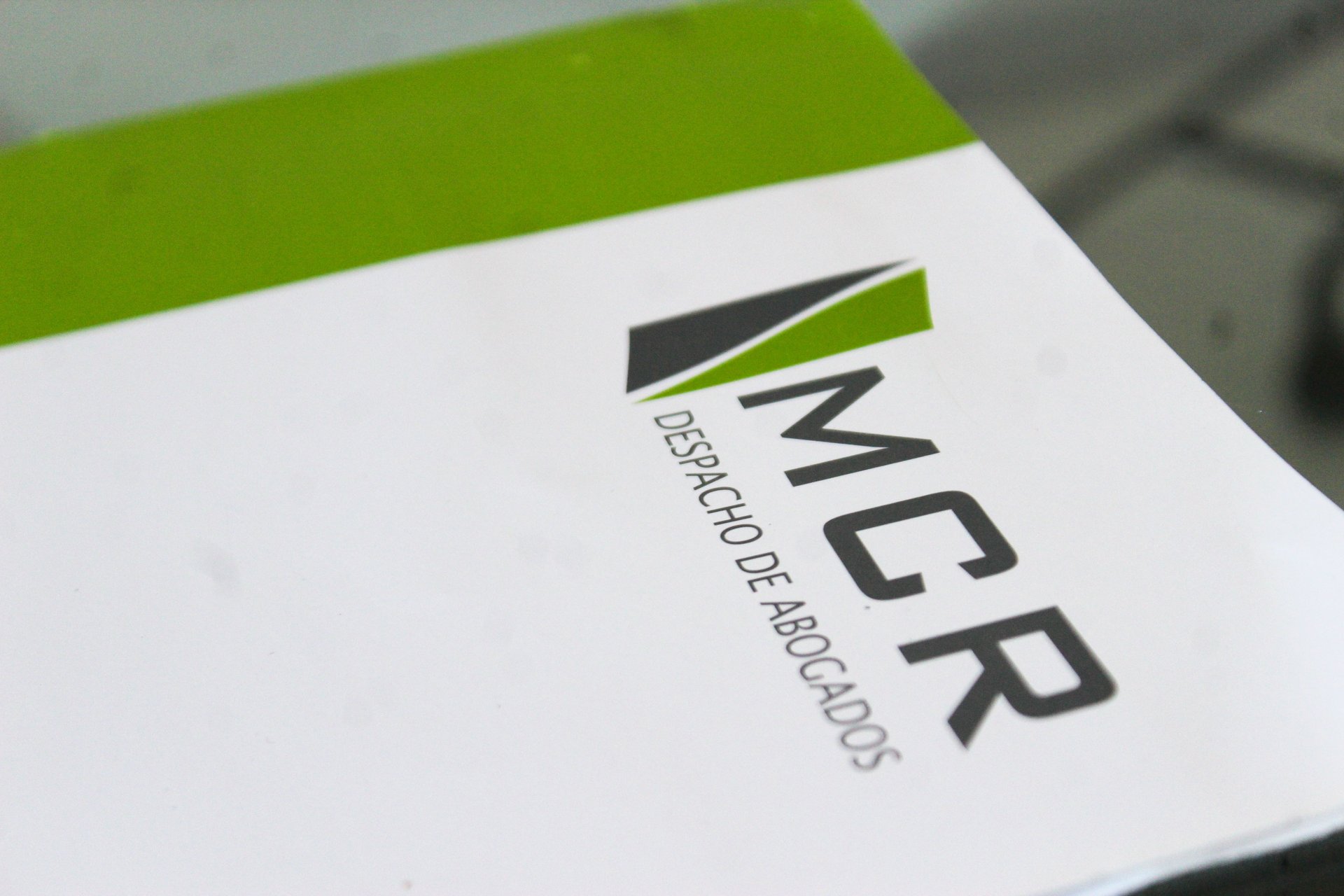 an abstract photo of a curved building with a blue sky in the background