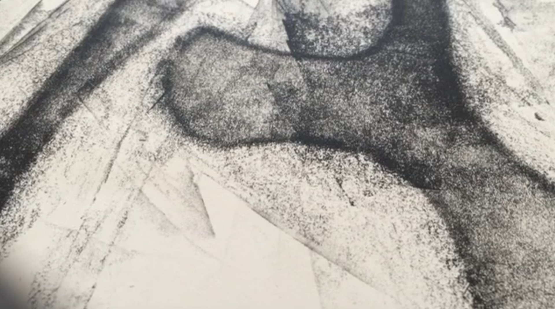 an abstract photo of a curved building with a blue sky in the background