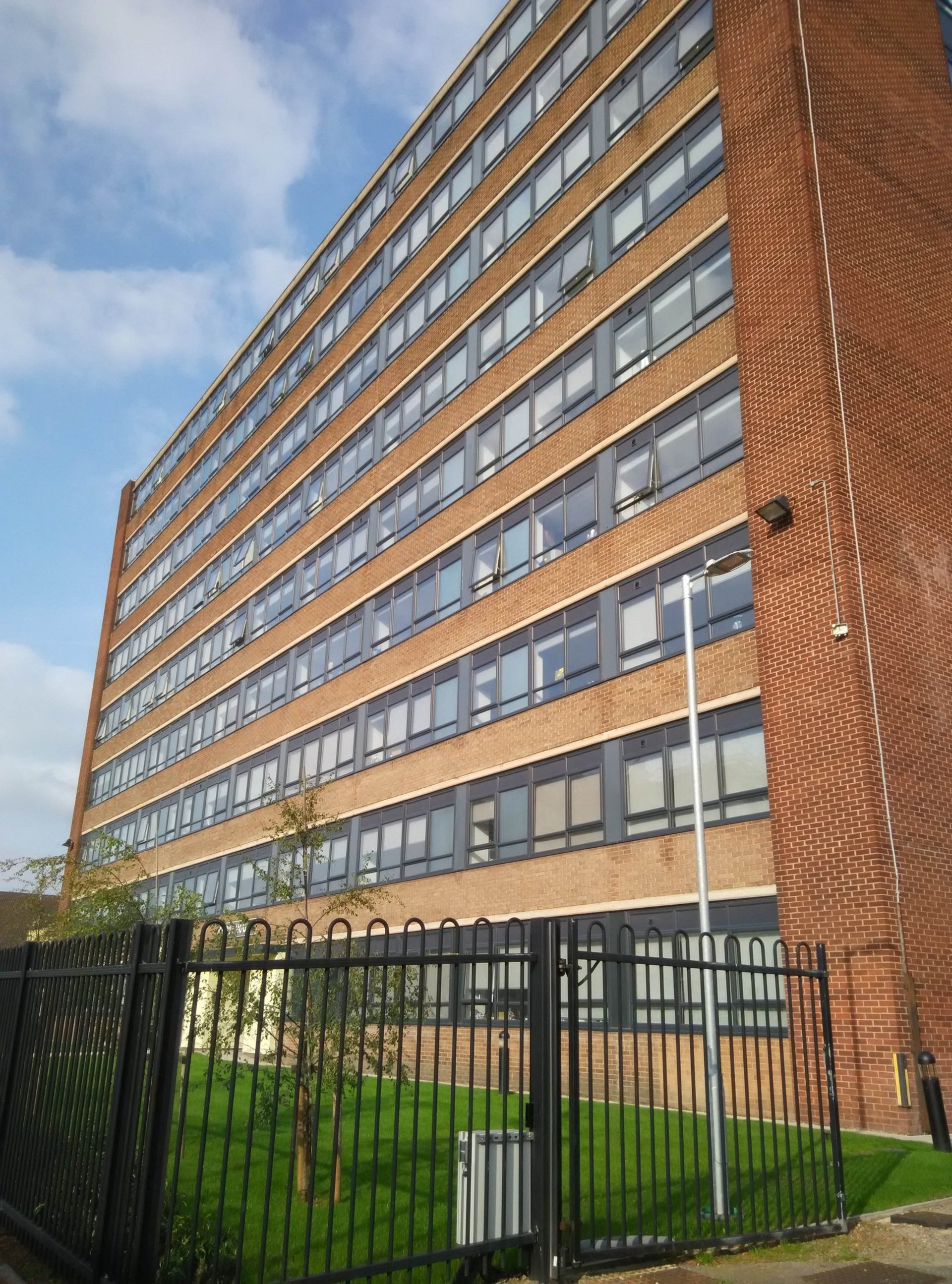 black and brown leather padded tub sofa
