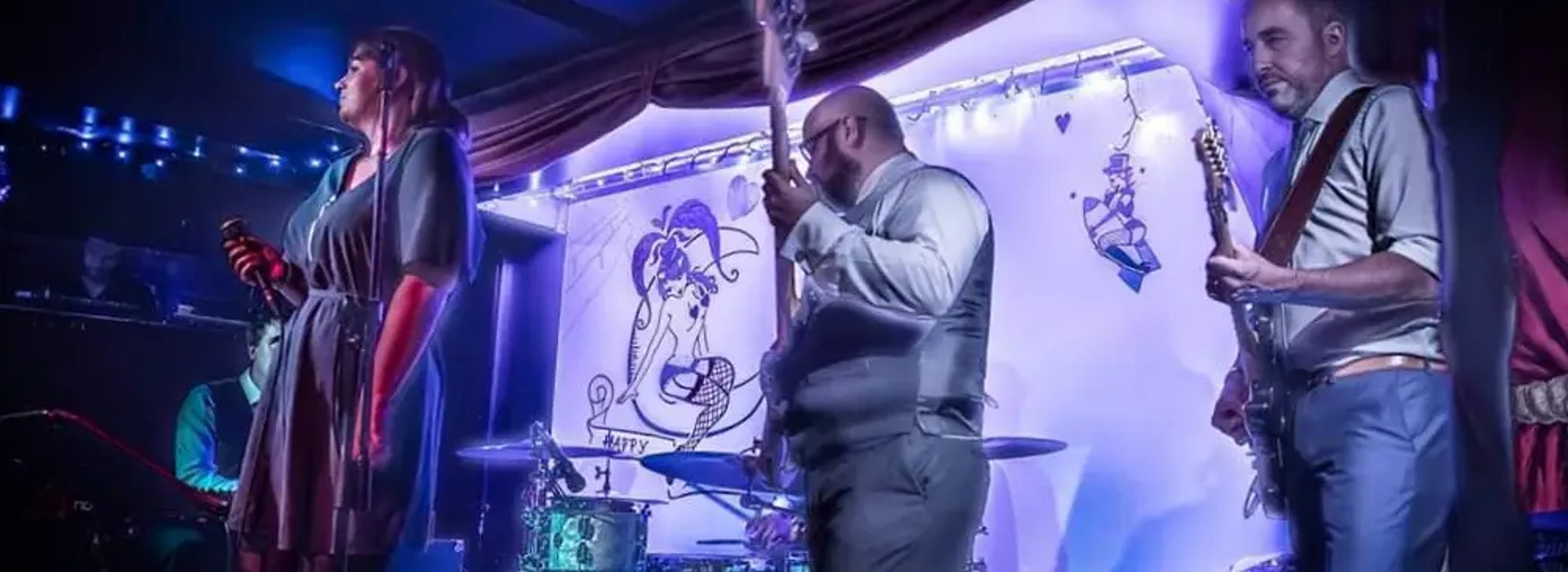 Lead singer of Mosaic performing soulful Americana vocals at a wedding in Devon