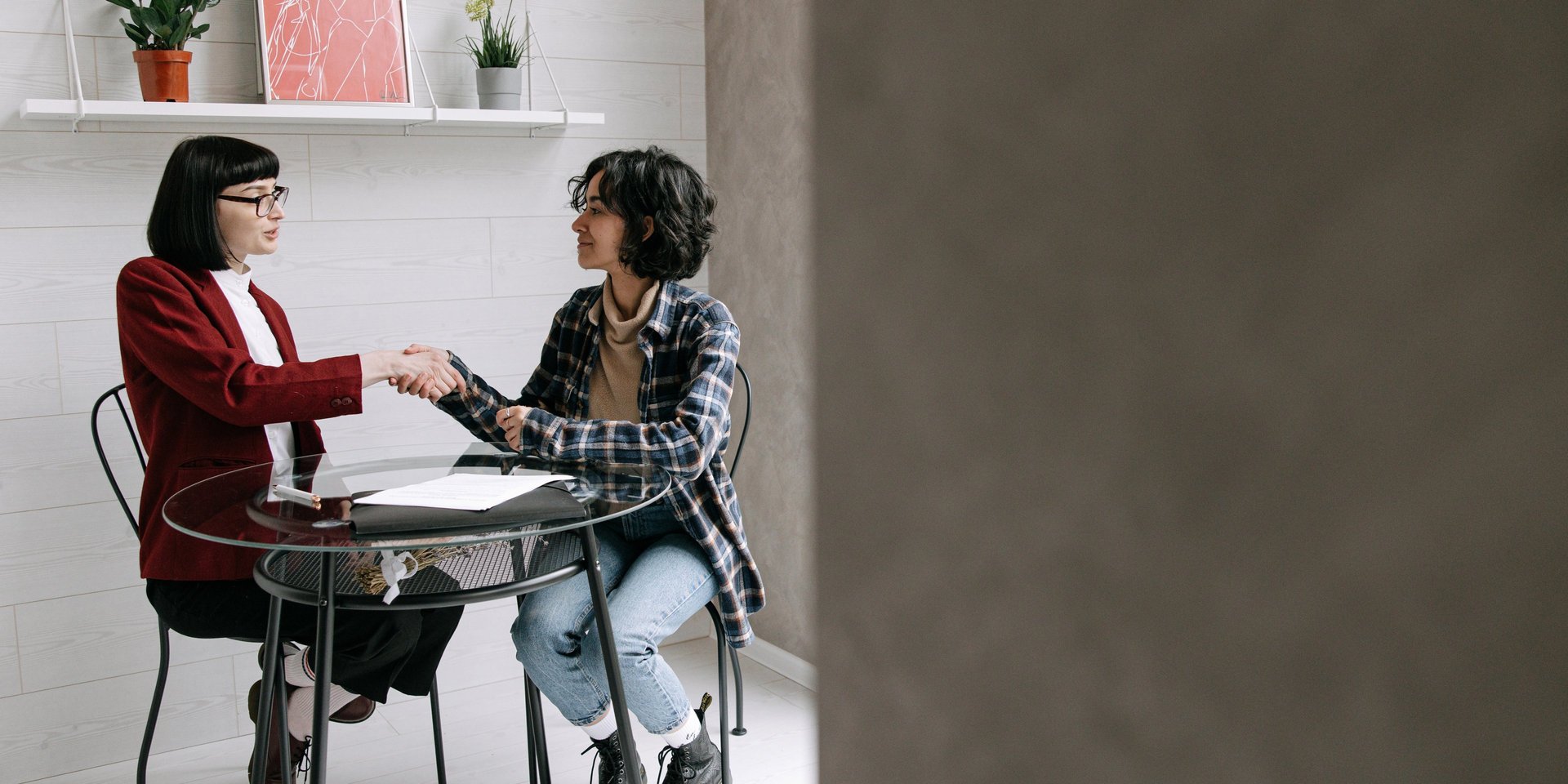 Business partners shake hands, making a deal.