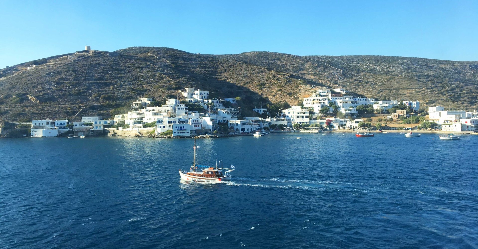 woman wearing yellow long-sleeved dress under white clouds and blue sky during daytime