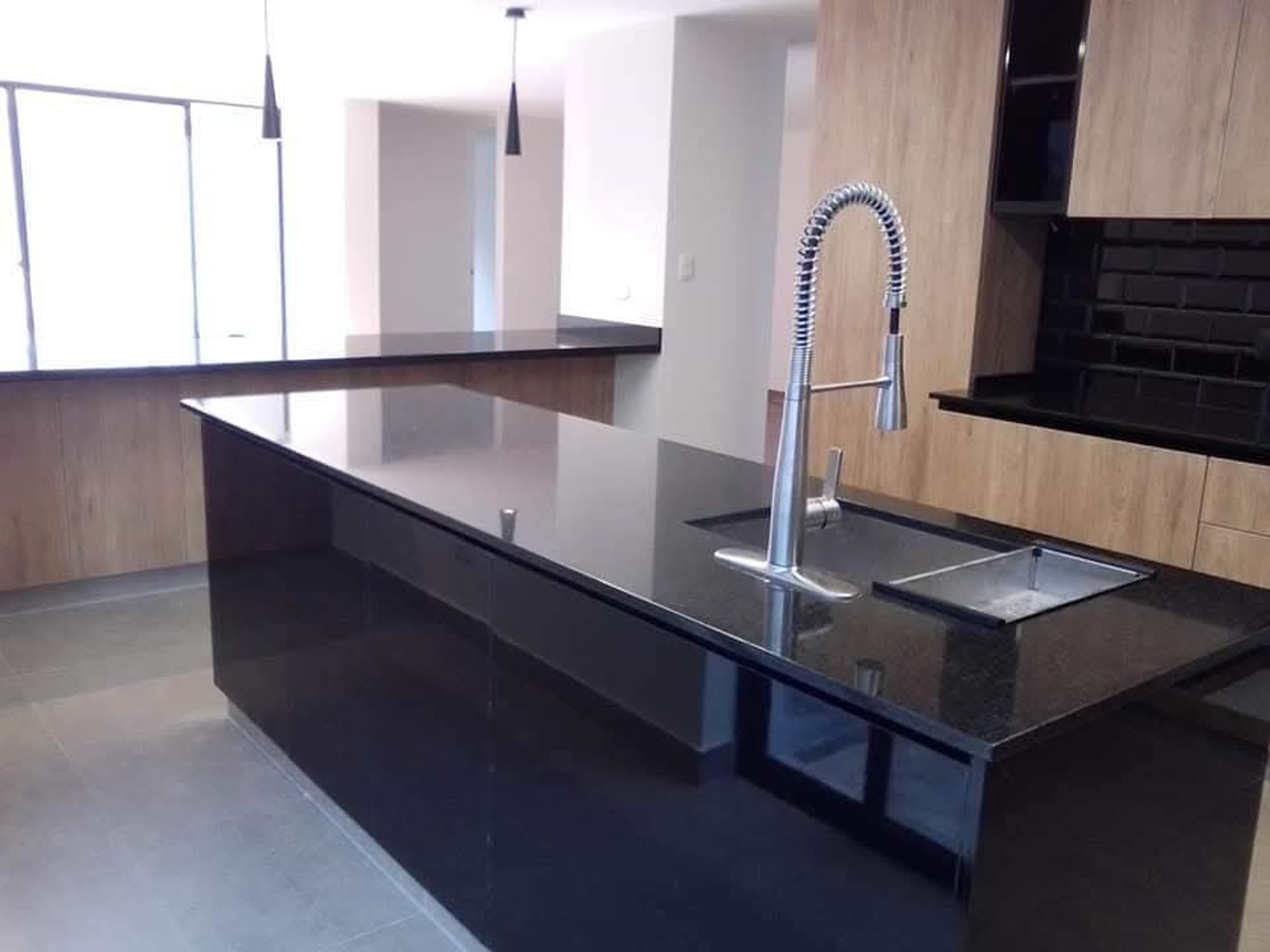 an abstract photo of a curved building with a blue sky in the background