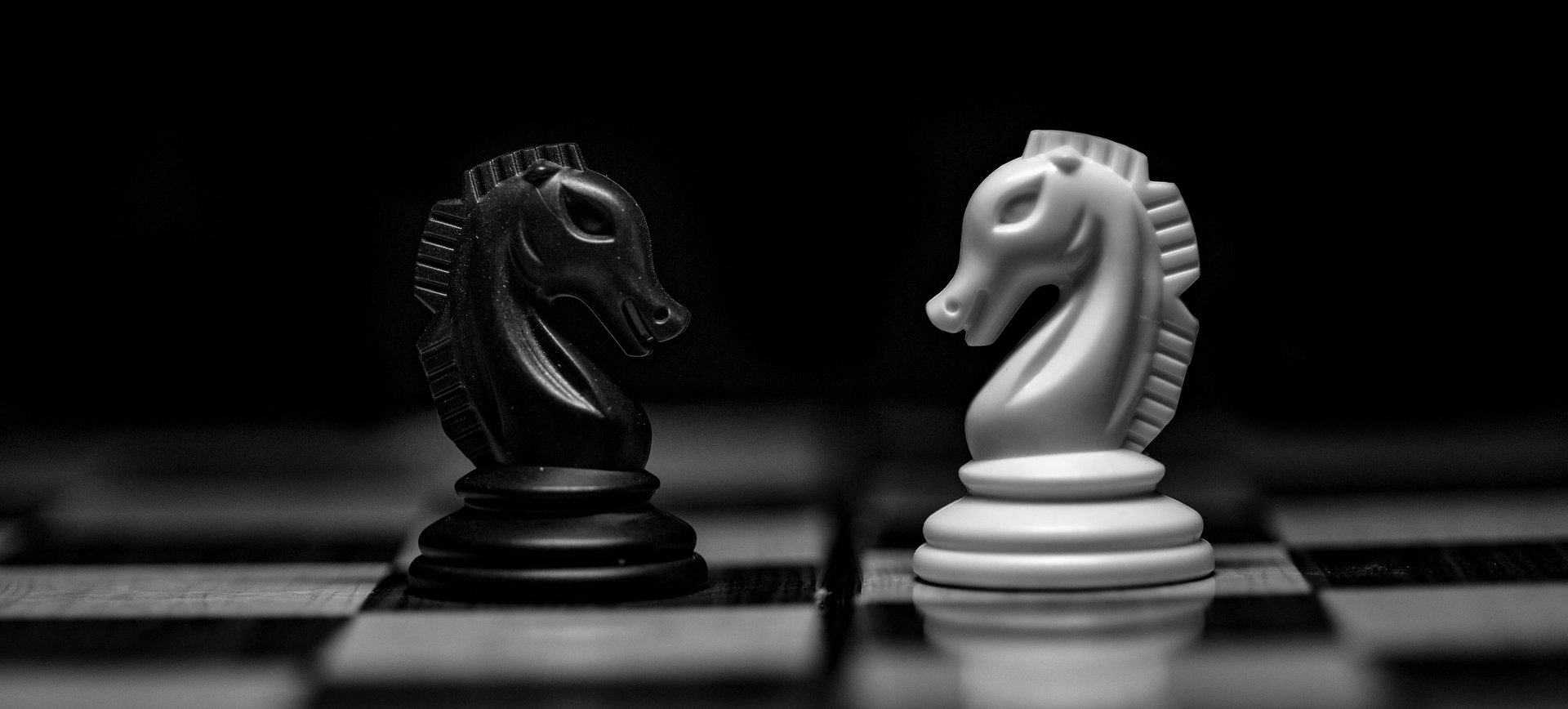 white ceramic figurine on black table