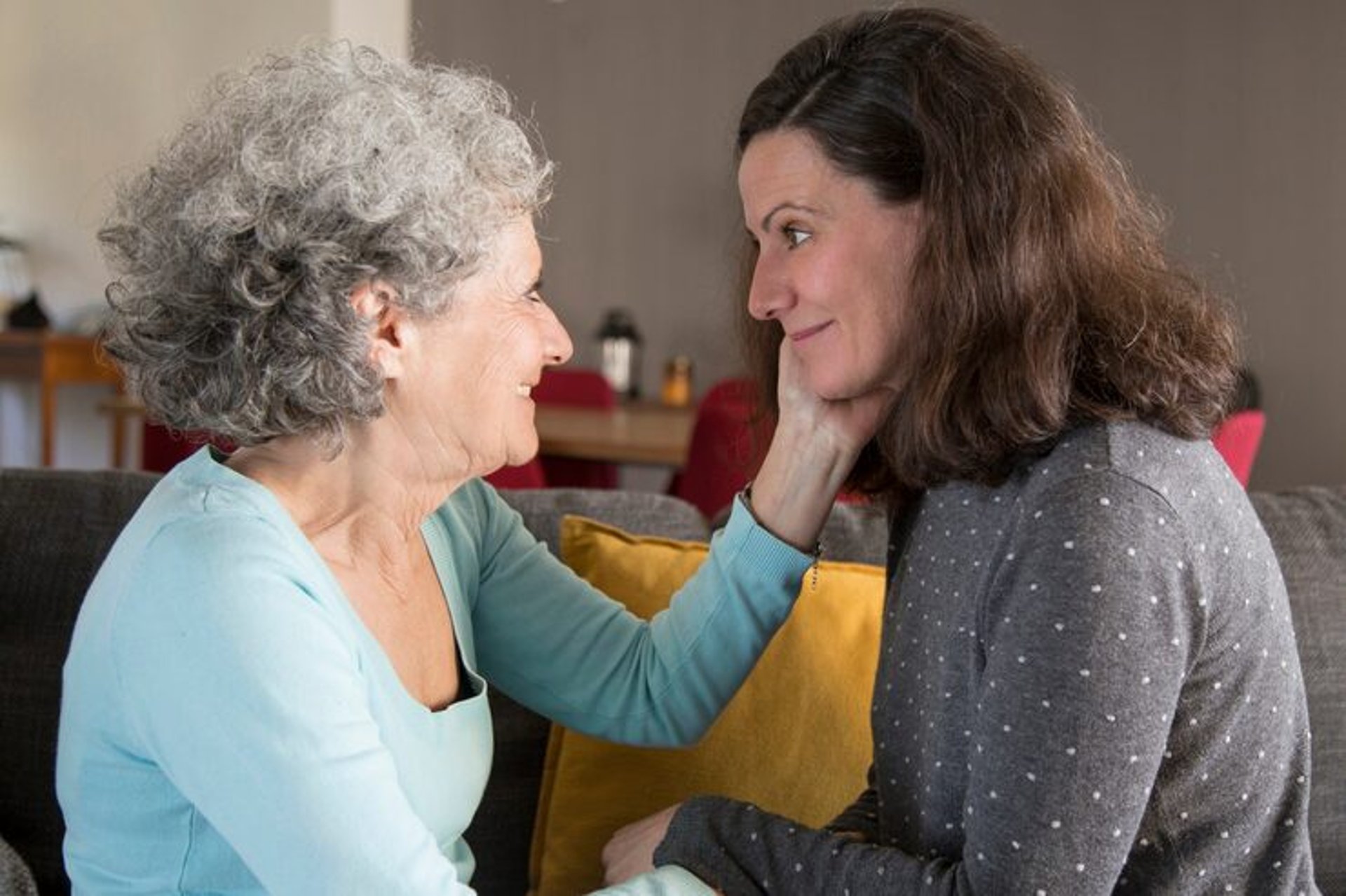 woman wearing yellow long-sleeved dress under white clouds and blue sky during daytime