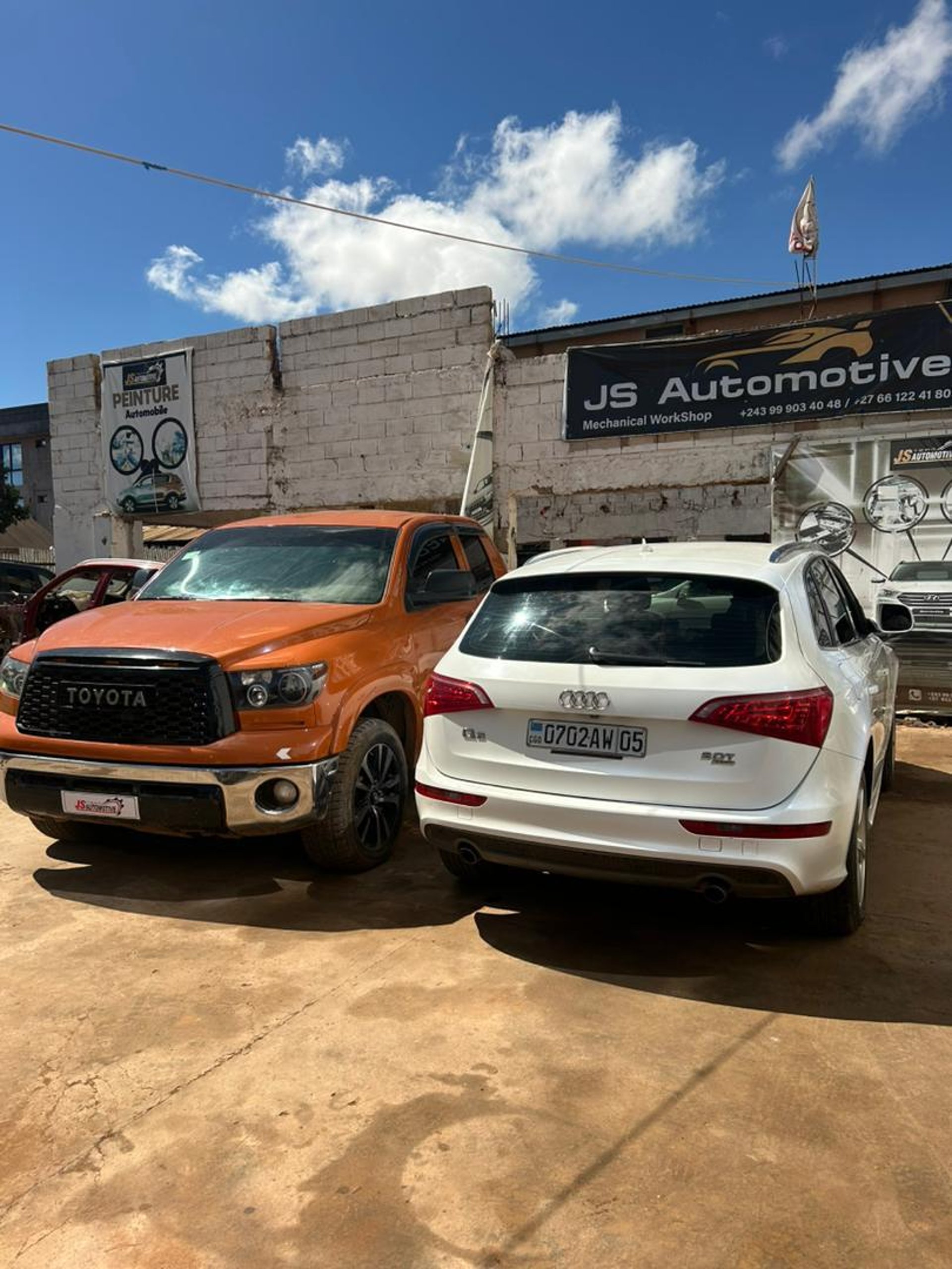 an abstract photo of a curved building with a blue sky in the background